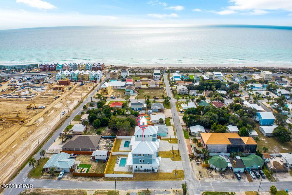 UNDER CONTRACT.SELLER ACCEPTING BACKUP OFFERS Looking for a Luxury Vacation Home that's Income Producing? Welcome to your stunning, three-story, 8 Bed/ 7.5 Bath luxury beach home with gorgeous views of the Gulf of Mexico. Indoor and outdoor living collide gracefully in the main living area, which features glass sliding doors that open up to the private pool/spa, outdoor shower, and fenced-in backyard. Located in the quiet beach community of Bid-A-Wee Beach, in the heart of Panama City Beach, Florida, you'll have PRIVATE, GATED BEACH ACCESS down the street. This luxury beach home is ready to cash flow. This luxury beach home sleeps up to 22 guests,  with vacation rental income projections estimated at $250K- $260K annually. Outside, the private saltwater pool takes center stage and is perfect for enjoying barbecues and entertaining friends and family. On the first level, you'll find an expansive living and dining area and a spectacular chef's kitchen offering custom cabinetry, High-End GE cafe appliances, a natural gas stove, a 48-inch GE Cafe refrigerator, and quartz countertops. This luxury beach home features multiple primary bedroom suites, with 4 of the 8 bedrooms having their own private ensuite bathrooms. The third floor offer three bedrooms, and a large rec room, as well as an expansive private balcony that showcases stunning views of the Gulf of Mexico. This beach home also features a small attached garage, which is perfect for parking your golf cart, or storing beach equipment.  Life is truly a vacation when you're just a short golf cart ride away from Bid-A-Wee's gated beach access with over 2200 feet of Dedicated Beach. This home is currently under construction and is expected to be completed February 2023. Designed and built by Mulder & Company, a locally owned, trusted builder known for their exceptional craftsmanship and attention to detail. **All interior listing photos are pictures of a model home that has similar finishes to this home, once construction is complete.** Floor plans and a list of all the upgrades and the specs for this home are available upon request. Call today to see this beautiful beach home in person!