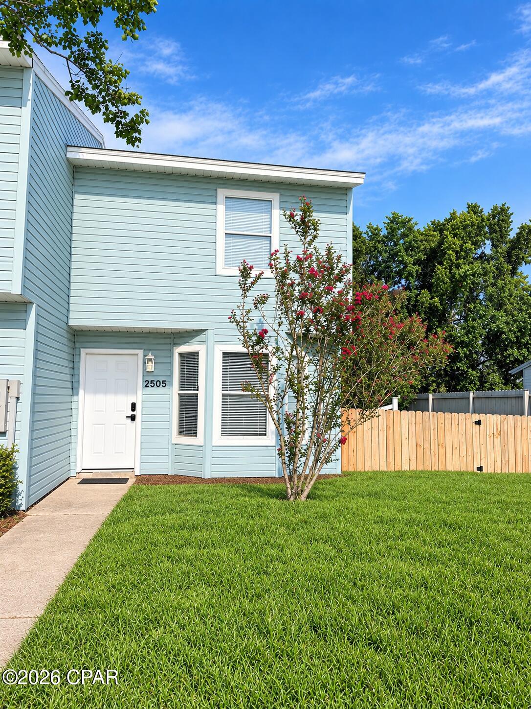 It is ALL about the location with this great end unit townhome! Plenty of places to walk to (Publix, Sonny's, Starbucks, Waffle Houses, Whataburger....just to name a few). Very quiet neighborhood just off of Hwy 77 in Lynn Haven. If convenience had a picture it would be this location. This end unit townhome offers a fully fenced yard. There are 2 bedrooms and a full bathroom upstairs as well as a linen closet. Downstairs you have new LVP flooring and a new open concept kitchen, dining and living room area with a half bath and access to the fenced in yard. Both bathrooms have new toilets. The HVAC system was replaced in 2023. The roof was replaced in 2019. This townhome was once used as a rental and brought in $1300 month. Schedule a showing today!