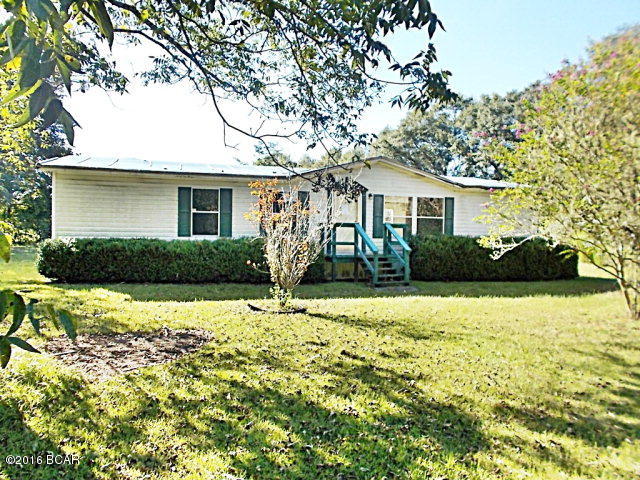 PRICE REDUCED!! Great potential to own your home in the country on 1.37 acres. This doublewide has a large living room with a fireplace, nice size kitchen with dining area, 3 bedrooms and 2 baths. It has a nice size back yard with plenty of room for animals, pets, and room for a small garden. The location is on a paved road and just a short drive into Marianna where you have access to Walmart, Lowes and several nice restaurants close by.