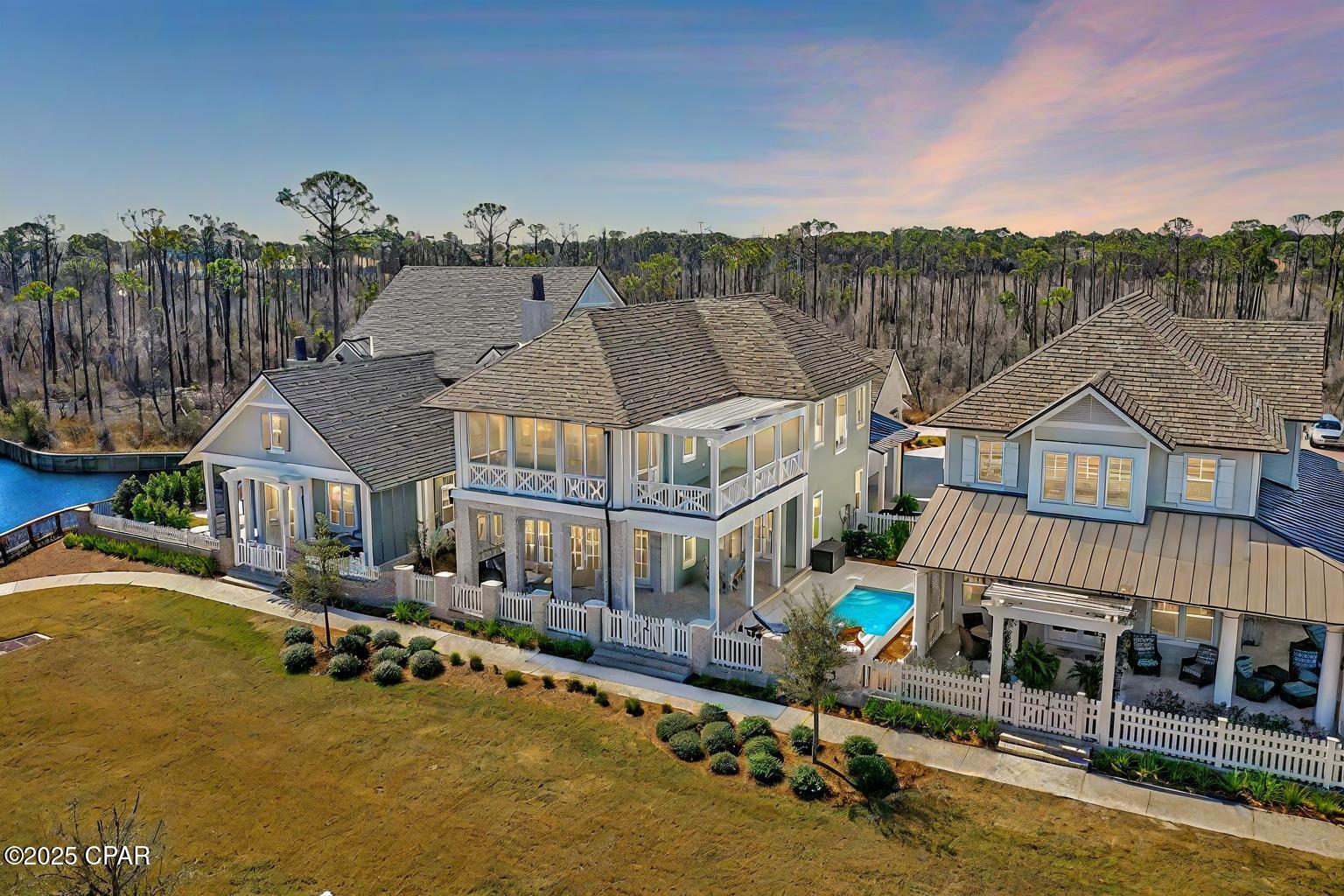 Tucked behind the gates of Regatta Bay, this custom Destin retreat was designed for the buyer who wants luxury without compromise. A home that feels elevated, private, and built for the way people actually want to live on the Emerald Coast.

From the moment you enter, the home delivers a warm, refined atmosphere with soaring ceilings, rich architectural detail, natural light throughout, and seamless indoor-outdoor flow. The open-concept design was made for entertaining, whether hosting friends around the chef's kitchen, opening the living space to the resort-style pool area, or enjoying quiet evenings after a day on the water or golf course.

The kitchen anchors the home with premium finishes, custom cabinetry, quartz countertops, high-end appliances, and an oversized island that naturally becomes the center of the home. The main living areas feel both sophisticated and comfortable, blending luxury finishes with an inviting coastal warmth that is difficult to find in newer construction today.

The primary suite offers a true private retreat with spa-inspired finishes, generous space, and direct access to the outdoor living area. Additional guest suites provide flexibility for family, entertaining, or working remotely while maintaining privacy throughout the layout.

Outside, the backyard was designed to feel like a private resort. The pool, covered outdoor living space, and lush tropical surroundings create an atmosphere that feels worlds away while still being minutes from Destin's beaches, boating, dining, shopping, and entertainment.

Located inside one of Destin's premier gated golf communities, Regatta Bay offers a lifestyle centered around convenience, luxury, and recreation with golf, tennis, walking trails, and close proximity to the marina and Gulf waters.

This is more than just a beautiful home. It's a rare opportunity to own a refined coastal retreat in one of Destin's most desirable communities.
