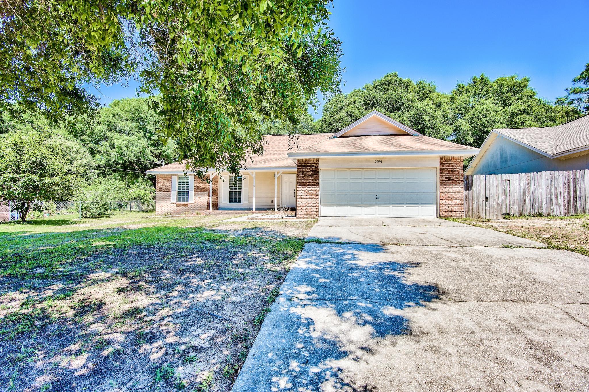Just One Look At This Adorable Home & You'll Easily Fall In Love! With 3BR/2BA + 2 Car Garage With Approx. 1552 Sqft., It's The Perfect Place To Call Home! Conveniently Nestled Just South Of I-10 On A Spacious Fenced Lot Offering Additional Storage In The Oversized Shed In The Backyard. Located Just Mins From Dining, Shopping & Entertainment In The Heart Of Crestview & A Short Drive To The Beach. Don't Miss The Opportunity To Make This One Yours...Call Today To Arrange Your Private Viewing!