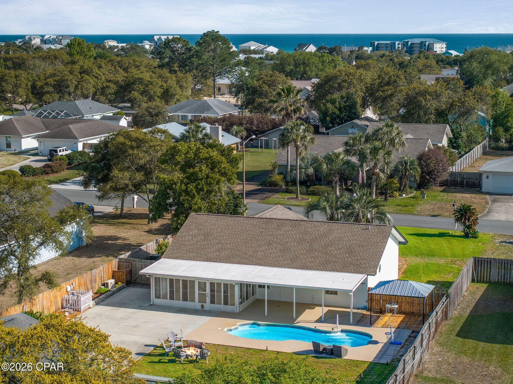 Located in the highly desirable west end of Panama City Beach and 5 minutes to 30A in the Gulf Vista Subdivision, 206 Nancy Avenue offers a rare opportunity to own a spacious coastal home on an oversized .33-acre lot just minutes from the beach with a pool& guest house and a large separate building/Garage. Last home at 210 Nancy sold for 850k. Priced at recently appraised value. This is  Perfect for full-time living or a second home or STR , this property delivers the ideal combination of privacy, outdoor living, and unbeatable storage for all your beach lifestyle needs.
This 3-bedroom, 2-bathroom home and 1 bath 1 bed guest house features approximately a total of  2258 square feet of living space in house which this area includes 3 bed 2 bath and an open living and dining layout, and a year round Florida room that has a mini split that seller used area as his office also included.  Guest house approx 600sq ft  functional floor plan designed for low-maintenance coastal living. Concrete Drivway goes all the way back to the detached Garage which could become the Game room for your vacation rental. Step outside to a large covered back porch overlooking your private backyard oasis, complete with an in-ground pool, covered patio space, tropical landscaping, a fenced yard, outdoor shower, and firepit, perfect for relaxing or entertaining year-round.

One of the standout features of this property is the exceptional parking and storage setup, featuring an attached one-car garage plus a detached two-car garage, providing ample space for vehicles, boats, golf carts, or workshop use. An additional heated and cooled mother in law cottage or Vacation rental bonus area adds even more flexibility, ideal for guests, hobbies, a home office, or extra storage.

Unique Home with hard to find  huge yard 100 x 150 close to Beach . Situated in the quiet, golf cart-friendly Gulf Vista subdivision where short-term rentals are permitted, this home offers a peaceful residential setting while still being close to shopping, dining, and the beach. If you've been searching for a west end property with space, a pool, multiple garages, and true coastal lifestyle potential, this is one you don't want to miss. A close 5 minute drive to 30A without the  30A price. Furnishings have been removed and home is ready for a new owner.