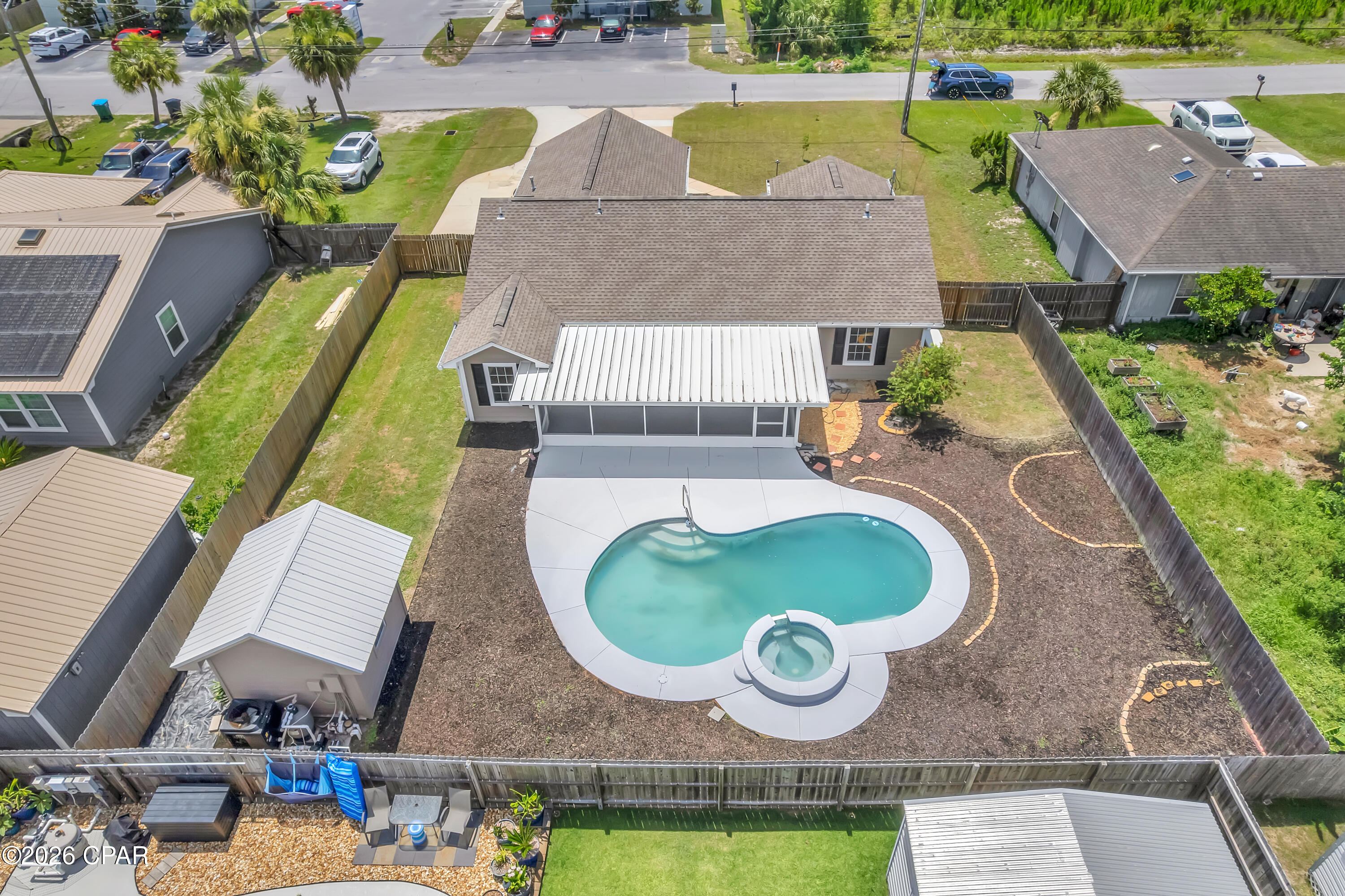 FRESH UPDATES. PRIVATE POOL. CLOSE TO TYNDALL. 1321 South Berthe Avenue in Panama City offers a well-cared-for three-bedroom, two-bathroom home near Callaway Point with a split floor plan, inviting outdoor space, and thoughtful updates throughout. Recent improvements include newly painted interior and exterior surfaces, brand-new carpet in the bedrooms, and LVP flooring throughout the main living areas.
Inside, the living room features a vaulted ceiling, a comfortable central layout, and two sets of French doors that open to the screened Florida room. The kitchen offers white shaker cabinetry, granite countertops, a gas stove, and a separate nook with a wine rack and hanging storage for wine glasses.
The primary suite includes a separate sitting area, a sliding glass door to the screened Florida room, a barn door leading to the bathroom, a vanity with ample storage, a walk-in closet, a tub/shower combination, and a private water closet. The guest bathroom features a walk-in tiled shower, and the hallway laundry area includes both gas and electric dryer connections.
Outdoor living is a major highlight, with a screened Florida room that includes a gas stub for compatible outdoor-rated equipment, including select outdoor grills, plus a kidney-shaped in-ground pool, a spacious yard, and a storage shed for tools and outdoor equipment. The property also includes side parking suitable for a boat, a double-car garage, a natural gas whole-house generator, and sprinklers on well water with a fertilizer injector.
With fresh paint, new carpet, a private pool, and a location close to Tyndall Air Force Base, 1321 S. Berthe Avenue brings together comfort, convenience, and easy days near Callaway Point.