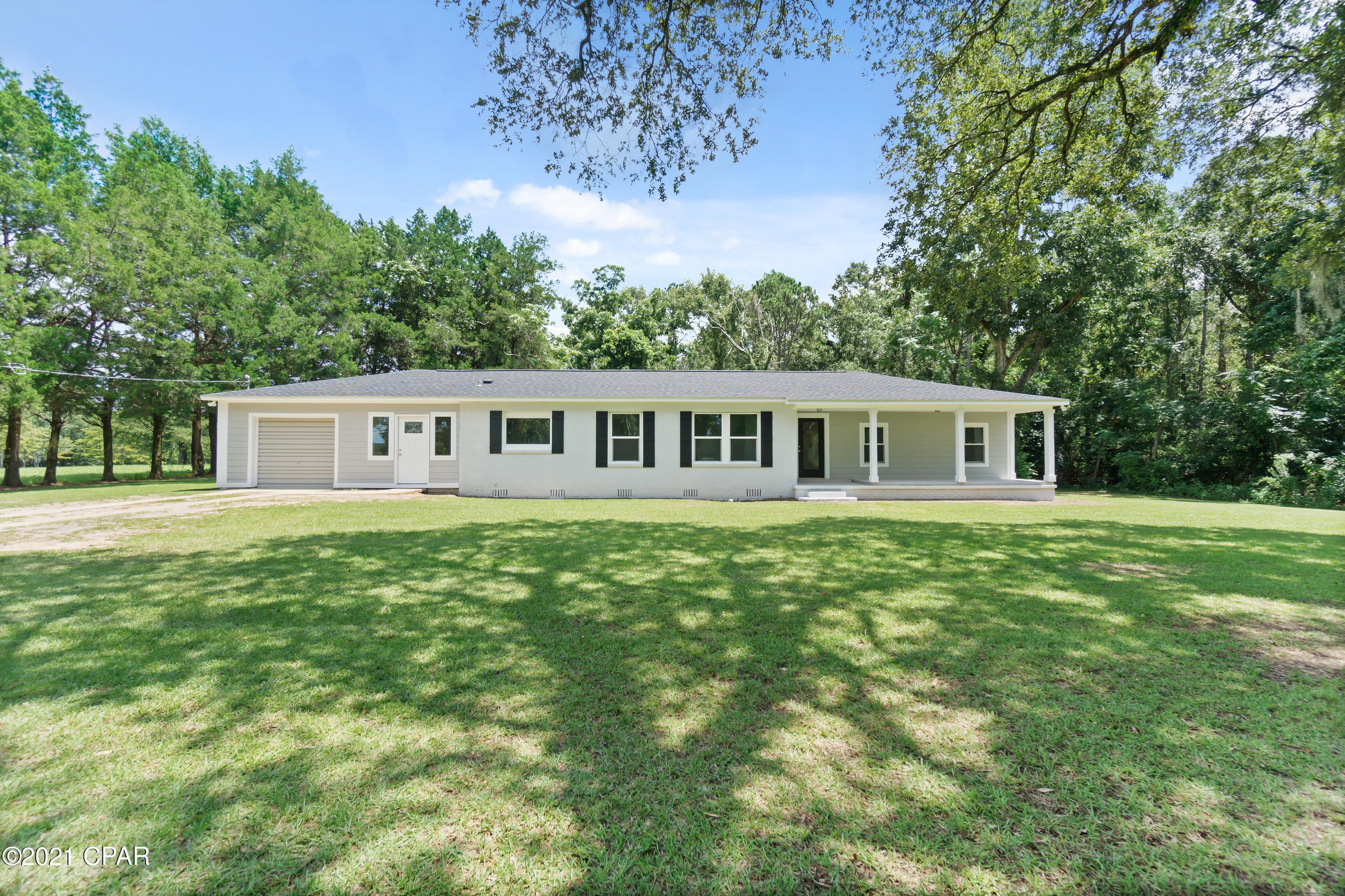 You will love the charm and quality of this recently renovated craftsman style home situated on almost 2 acres! This 3-bedroom, 2 bath has undergone an extensive overhaul including new energy efficient windows, custom trim work, fresh paint throughout, luxury vinyl plank flooring and a large living/dining area that flows into the spacious kitchen with an abundance of cabinets and quartz countertops. Other inside features include a spacious master bedroom with en suite bath, oversized laundry room, updated electrical, plumbing and HVAC. The exterior boasts a new shingle roof, covered front porch, attached garage and newly painted brick/hardie siding. Home is located just outside Bonifay city limits, a short drive to schools, restaurants and I-10.