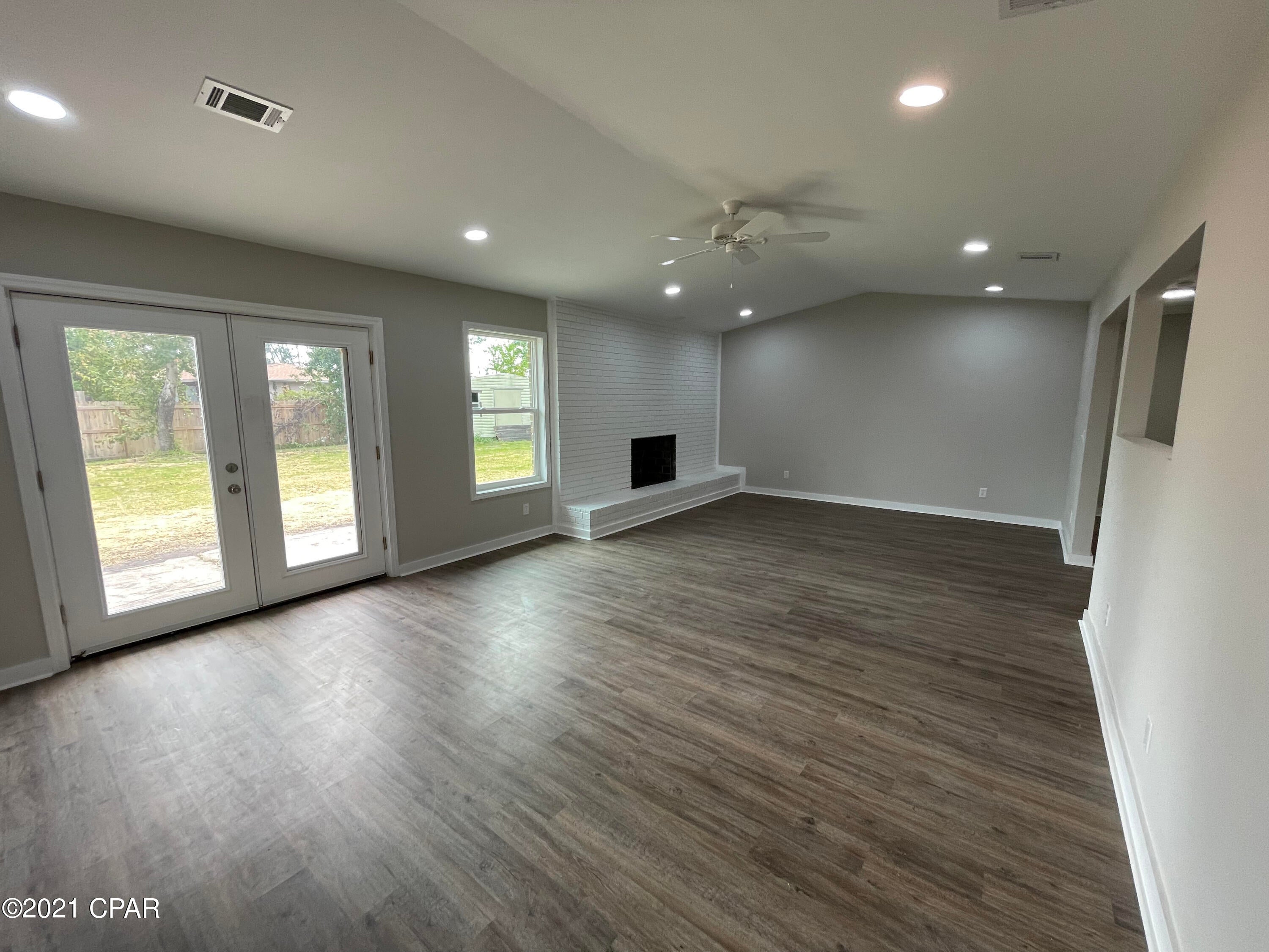 Renovated 3/2 in Lynn Haven in the neighborhood of Belaire Estates - close to Mowat & Mosley schools, shops, restaurants and more. Split floor plan, 3/2 with large family room w/wood burning fireplace, kitchen with eat-in dining area. All new doors/hardware, shingle roof, new fenced yard, sheetrock, electrical, light fixtures, new windows, garage door, new paint, all new electrical, lighting, kitchen cabinets, granite countertops, all new stainless appliances and new garage door. Washer/Dryer convey. Owner willing to paint brick exterior and garage door at no cost with a full price offer. Large storage building in the back yard and more storage inside the home itself! Located near Publix Shopping Center!