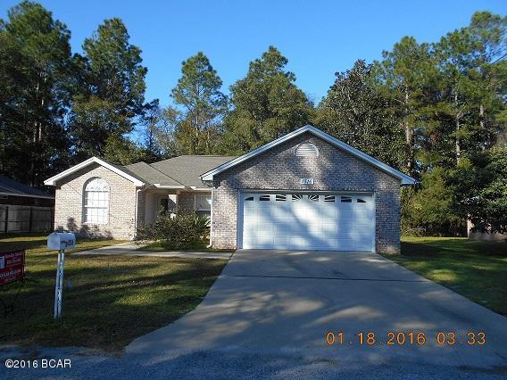 Motivated Seller! 3/2 brick home in Lynn Haven with open floor plan, wood flooring, split floor plan, electric fireplace & louvered blinds, jacuzzi tub & his-n-her walk in closets in master bath, 2 car garage and sprinkler system. All info taken from appraiser site & sizes approx.