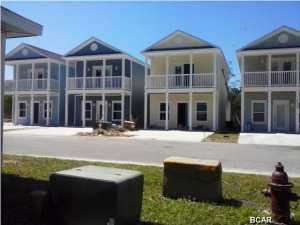 Charming Cottage style Brand New 2 story home in Gated community. Master bedroom on first floor. 3 Bedrooms/2 1/2 baths. Community pool in a 24 unit complex. Located very conveniently to the Navy Base, St. Andrews State Park and the worlds most beautiful beaches! This home is a most see. Master bedroom has its own full bath with full tile shower and glass shower door, and walk-in closet. Home features 9 foot ceilings, upgraded Fridgadaire Gallery Stainless appliances with side by side refrigerator, carerra marble countertops. Solid white shaker wood cabinets with glass door and crown molding. Each unit has a gated area for a large private storage space. Dead end street, Very close to beach and Front Beach Road. Home owners dues include lawn care, pool maintenance, garbage and