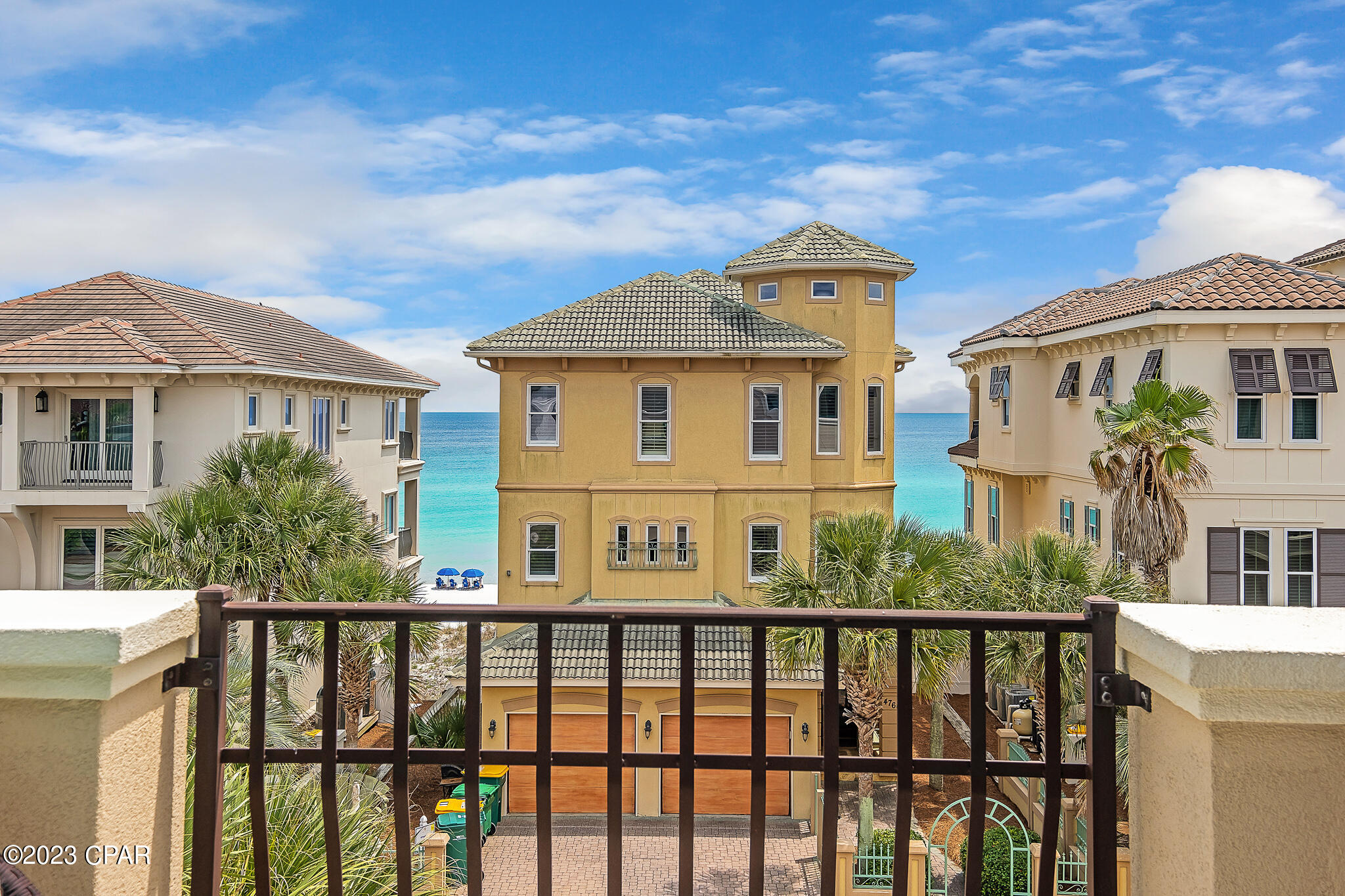 SHOWINGS TO BEGIN JUNE 12TH. See VIRTUAL TOUR & VIDEO. This immaculately well-kept and captivating beach home comes with 5 expansive bedrooms and 5.5 bathrooms. Come enjoy luxurious living in Destiny by the sea, an exclusive gulf front gated community along the emerald coast. Located just one tier from the gulf, spectacular views of the emerald coast may be enjoyed from any of the four balconies! As you step into the stunning entryway, comforting features within will let you know you're home. Hardwoods exude a legacy feel in the bedrooms, beneath a rare combination of fashionable and natural lighting. Neutral coloring throughout provides a calming feel, your inner stylist will find plenty of room to flex.

The efficient gas fireplace gives the living room a welcoming ambiance, creating a great spot for reading or a nap (perhaps both in that order). The spacious kitchen is perfect for holiday family gatherings; plenty of counter space and storage is provided along with custom cabinetry and designer stainless steel appliances. A classic island configuration maximizes workspace and flexibility. Head upstairs and you'll find two luxurious suites each with their own private balcony boosting incredible gulf views. Need to get some work done after your day at the beach? A quiet office with gulf views awaits, located just off the main suite. Two long driveways provide ample accommodation for up to four cars, as well as an additional two spots inside the garages. This home is absolutely perfect as a primary home, secondary or investment home! Destiny by the Sea is primely located near all your favorite restaurants and shops, SELLER INCLUDING AN 8 SEATER GOLF CART for added convenience! This gated community is perfect for families; boosting a large community pool, exercise room, private beach (2 access points steps away!) and security provided 24/7. Rental projections coming soon!