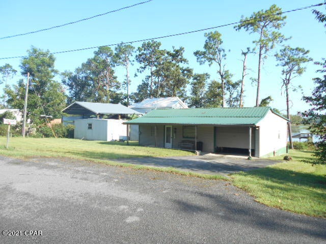 Pended taking backups...Lake Seminole Waterfront  Home with Covered 2 Slip Boat House & Dock PLUS Top Sun Deck that has a stairway that is above the boat slips! About 1300 SF Home (HAC) and over 1800 under roof! 3 BR, 1 Ba. This is home is on one of the absolute nicest lots on 38,000 acre Lake Seminole.  In Florida there are only about 10 lots that have a super view of the Lake and this is one of the top of that group! Across the large lagoon (several hundred acres) is Apalachee Wildlife Management Area! Lake Seminole is one of the top bass-fishing lakes in America! And one of the top duck hunting lakes in the Tri-State area! Ospry, Eagles, Ducks & Geese are frequent visitors!  Wonderful vacation home or retirement paradise! Super investment!