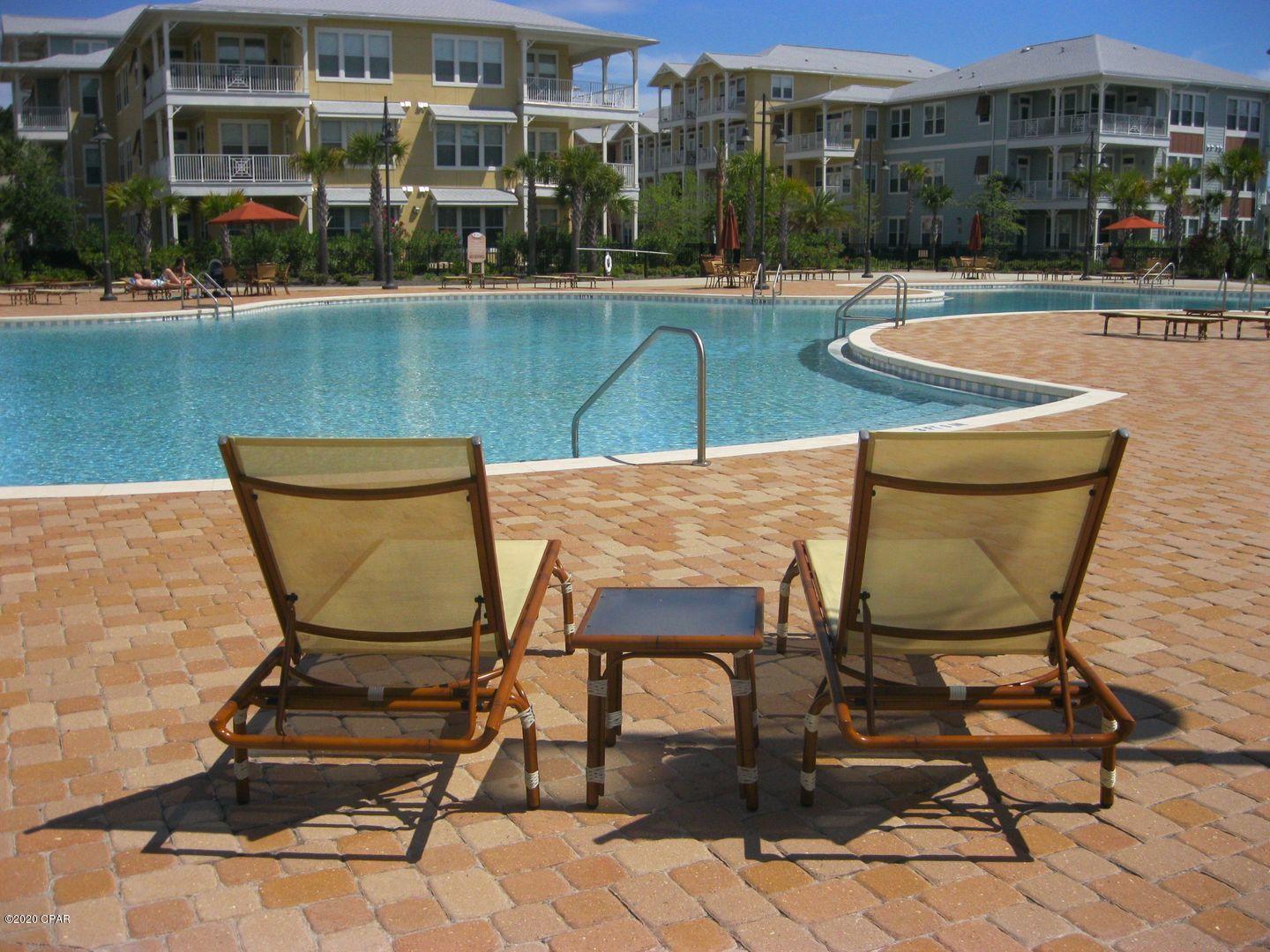 For rent! Gorgeous 2 BR, 2.5 BA condo at Island Reserve in the heart of Panama City Beach! This executive style condo features 10' ceilings throughout, wood flooring, stainless appliances and an open floor plan great for entertaining. The kitchen includes all appliances, granite counters and plenty of cabinet space. It overlooks the dining and living room area with french door access to the balcony. Split floor plan with both master suites having access to the balcony! The first master has a soaking tub, stand up shower and private toilet room. The second master has a large stand up shower and custom cabinetry. Washer/Dryer included; Island Reserve amenities include a resort style pool, clubhouse, indoor basketball court, exercise room, and beautifully landscaped court yard.