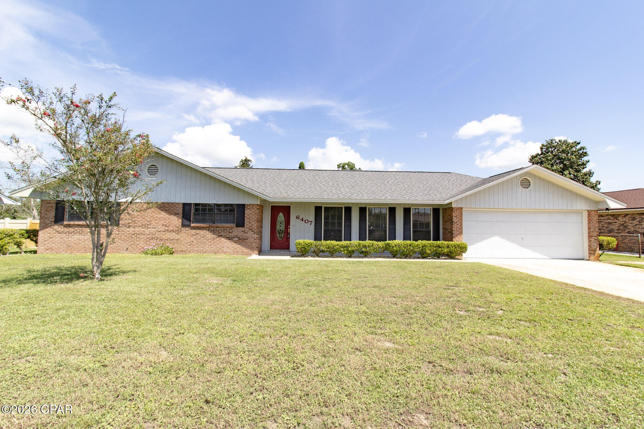 *Charming Updated Brick Ranch - Just 10 Minutes to Tyndall AFB | No HOA* Welcome to this recently updated brick ranch-style home offering comfortable living and convenient access--only 10 minutes to Tyndall AFB. Fresh paint throughout creates a bright, move-in-ready feel. Step inside to find new luxury vinyl plank flooring in the living areas, kitchen, and dining spaces, complemented by new carpet in the bedrooms. The fully remodeled kitchen features new cabinets, sink, countertops, and appliances, plus new lighting. Just off the kitchen is a dining area with a swinging door and a convenient breakfast nook. The large front living room is filled with natural light from three oversized windows. At the back of the home, a cozy second living space centers around a wood-burning fireplace and includes a built-in wall-to-wall shelving unit with desk--perfect for a home office, reading nook, or family gathering spot. New lighting and ceiling fans are found throughout. The primary bathroom offers a walk-in shower with glass door, a new vanity, and updated vanity lighting. The second full bath, shared by the two additional bedrooms, also features a new vanity and lighting. Outside, enjoy the large backyard complete with an extra-large  storage shed and a concrete patio right off the sliding glass door--ideal for outdoor living and storage needs. Best of all: **No HOA**. This well-maintained, thoughtfully updated home is ready for its next owner.  ROOF 2019