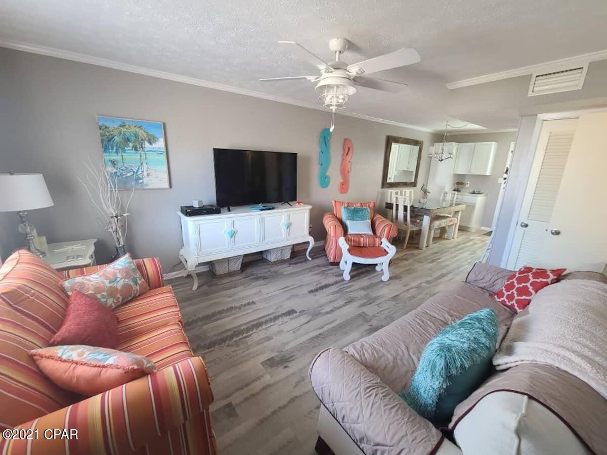 Are you ready for a great little condo close to the beach, this is it! Excellent unit only steps from the beautiful white sands of Panama City Beach. Exclusive gate to get you onto the beach anytime. Unit comes fully furnished and rental ready. The unit features brightly colored walls and beachy decor. The community also has a pool, laundry and restrooms located steps from your front door. Parking spot is located right outside your door so no parking ramps or trying to find a parking spot. 

Recently remodeled unit with new roof, A/C. windows, tankless water heater and new LVP flooring. All were redone in 2019-2020.