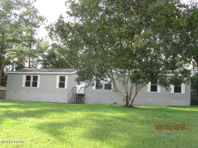 Nice DWMH located in Creekwood Subdivision in Marianna. Ready for your family with 4 Bedrooms 2 Baths, Living room plus a Large Family Room! Located on a 1/2 acre lot on a paved road! Family Room has a gas fireplace, vaulted ceilings. Kitchen has lots of cabinets space and center island and a breakfast bar! Split Bedroom plan@ Master Bathroom has double sinks, garden tub and separate shower! Call today for your personal showing! Wont last Long at this price! SOLD AS- IS.