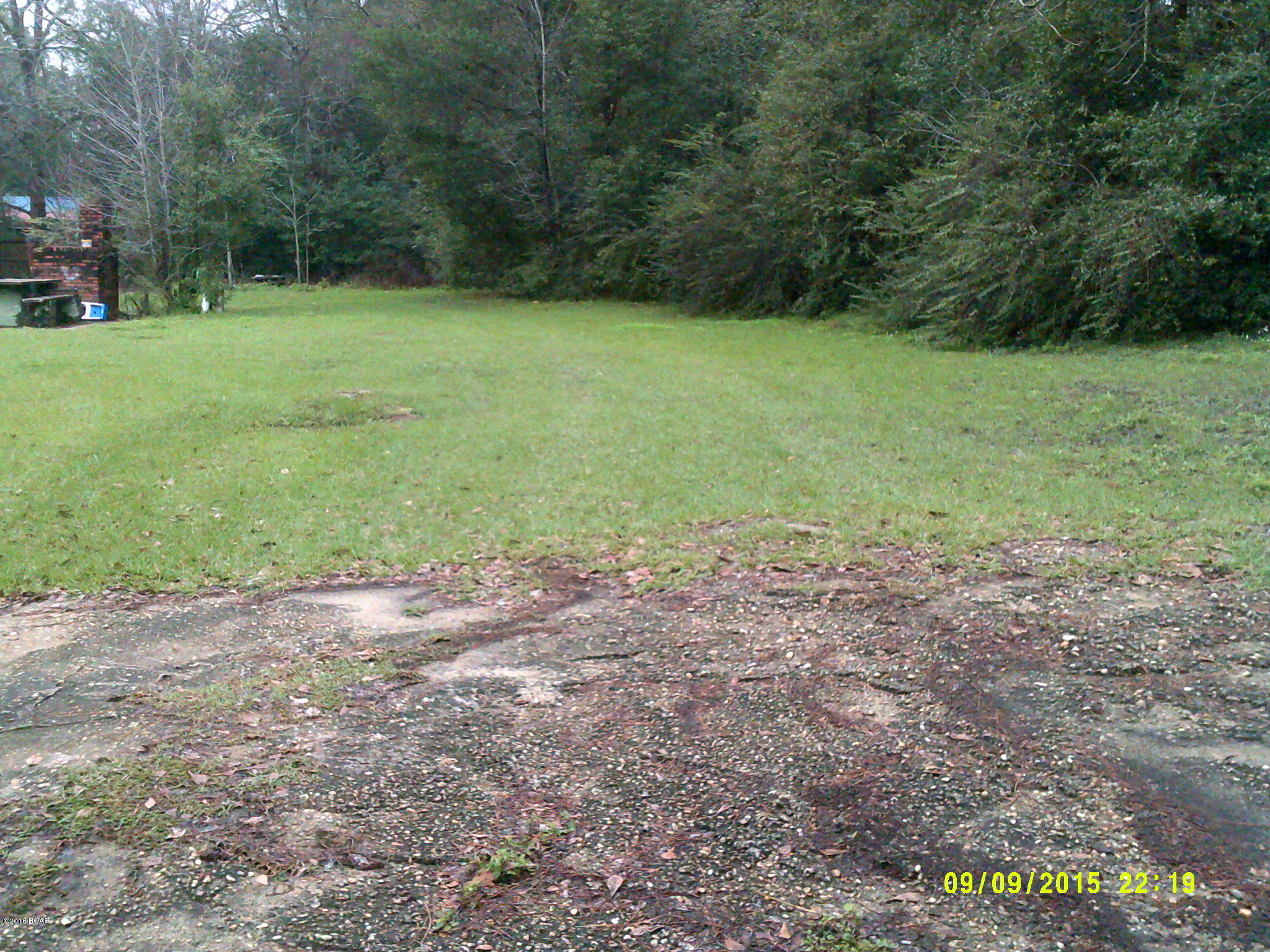 Buildable lot if you observe city set-back lines. 10' set-back line on the side. City utilities available. Lot is 50' wide. Road frontage is on an angle giving the front of lot 60' on road. Paved driveway entrance to lot.