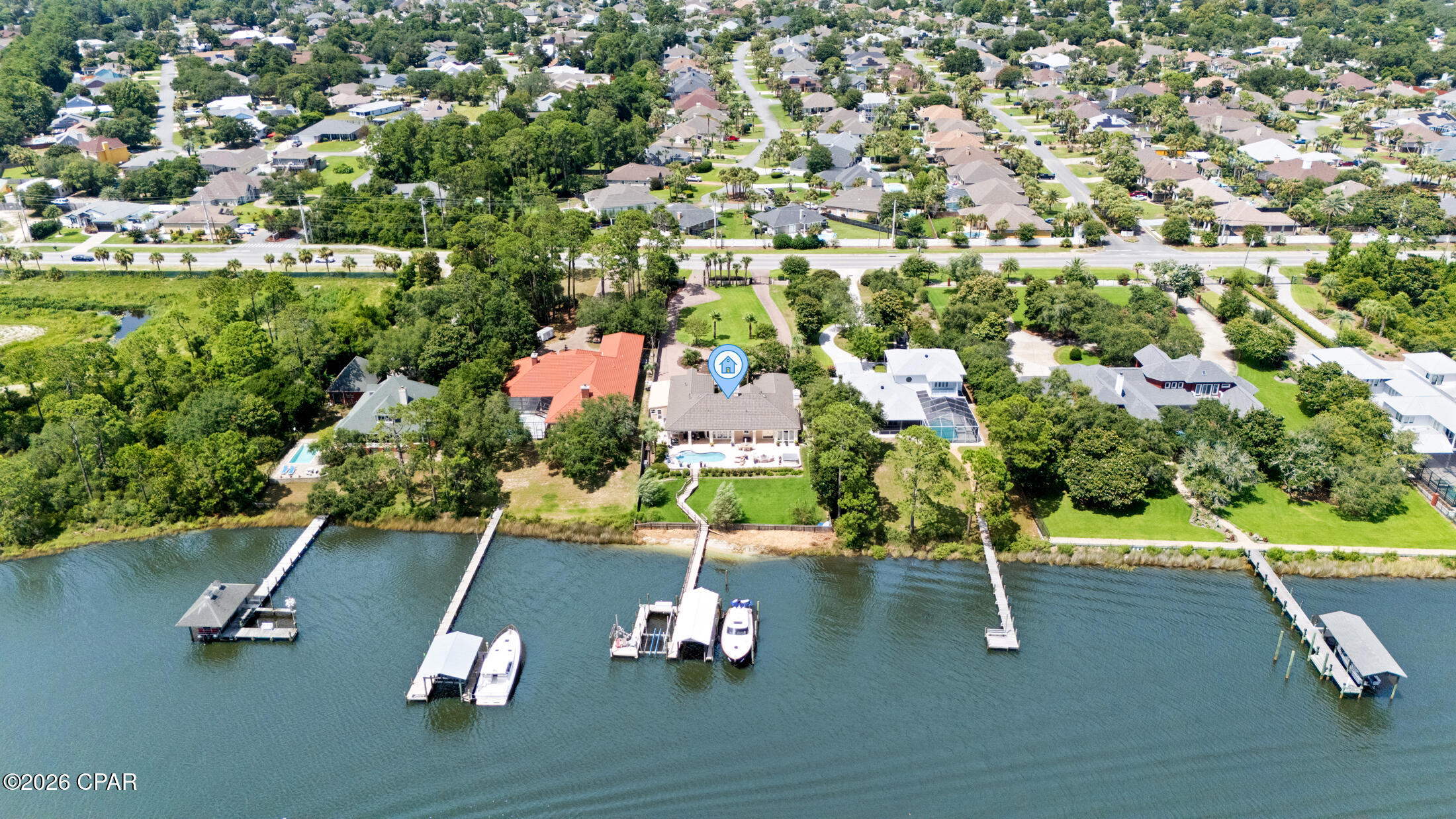 Waterfront luxury meets effortless coastal living at 8203 N Lagoon Drive. Perfectly positioned on deep water with direct access to the Gulf of Mexico in just minutes, this exceptional property offers the boating lifestyle you've been dreaming of--all with no HOA.
Designed for both everyday living and entertaining, this spacious home features 3 bedrooms, 2.5 bathrooms, plus a dedicated office, additional living room, and versatile flex space, all thoughtfully designed to maximize comfort and capture stunning views of Grand Lagoon.
Step outside to your private waterfront oasis where a new travertine pool deck surrounds the sparkling pool and expansive outdoor living areas, creating the perfect setting for relaxing or hosting family and friends. Boaters will appreciate the private dock complete with a covered boat lift and additional slip, providing easy access for multiple watercraft and unforgettable days on the water.
Additional features include a gated driveway, generous parking, and the privacy of a premier waterfront setting. Whether you're watching dolphins from your backyard, heading out for a sunset cruise, or enjoying the peaceful lagoon views from inside the home, this property offers a lifestyle that is truly unmatched.
This is a rare opportunity to own one of Panama City Beach's premier waterfront homes where luxury, convenience, and direct Gulf access come together in one extraordinary property.