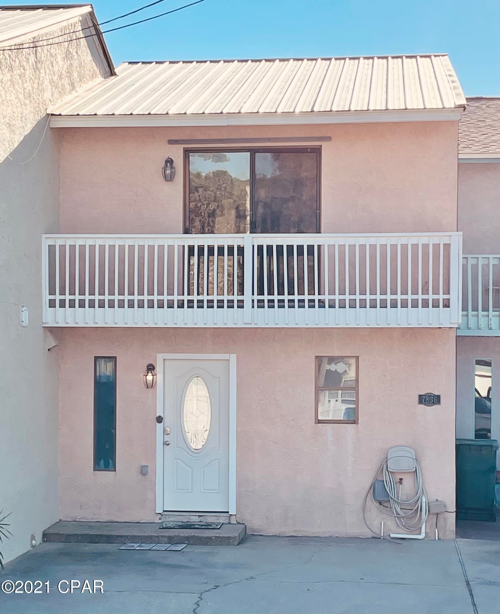 Move-in ready for your next primary home, vacation home, or rental investment! Located just minutes away from everything Panama City Beach has to offer including the infamous St. Andrews Marina and Pier Park. Covered in tile, the main floor comes complete with a kitchen, living area, full bath, breakfast area, and laundry. Walk out of the living room and into your own covered patio with a private back yard that has gate-access to Beach Dr. The upstairs contains new flooring and boasts two spacious bedrooms each consisting of their own balconies and individual vanities. Ample parking is available in front of the unit and via community spaces. Public beach access is within walking distance along with two public boat ramps a few blocks over. Absolutely NO maintenance fees! Come see it today!