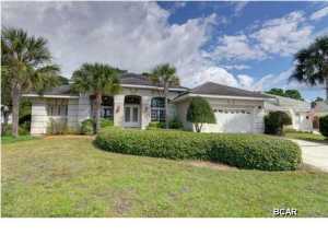 Enter the gated community of Emerald Bay and enjoy golf course views as you proceed to this immaculate Mediterranean single family home positioned on the 10th hole of the golf course. The great room has 12 foot ceilings, fireplace and retractable sliding doors that let you bring the outdoors in throughout all 4 seasons. Relax in your hot tub on your screened in patio. This property offers 3 bedrooms, with a split bedroom plan for privacy 3 baths in home office and formal dining room. Tile floors in the main areas with carpeted bedrooms and an oversized 2 car garage. Emerald Bay offers golf course with club house, bay access, tennis and community pools. HOA fees are only $225.00 per quarter. This home is located in Flood Zone X in a cobra zone.
