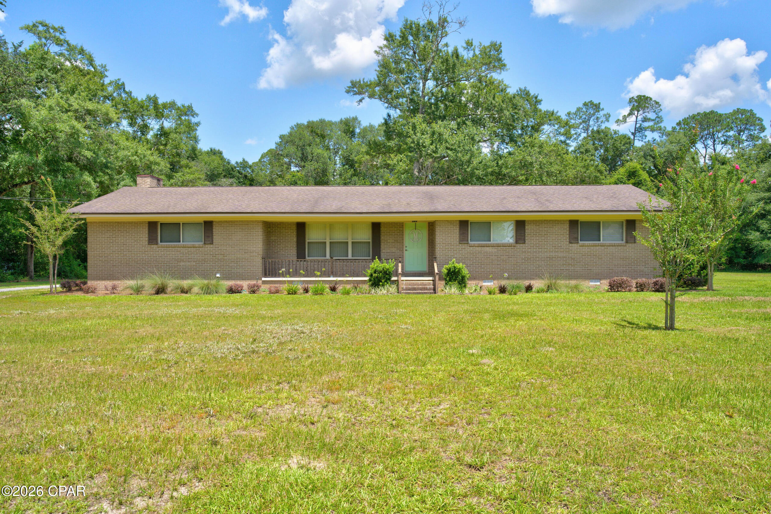 Rare find in the heart of Chipley! This spacious 3-bedroom, 2-bath ranch-style brick home offers over 2,800 square feet of living space and sits on 5 acres, giving you the perfect blend of in-town convenience and room to spread out. Step inside to an inviting open-concept living, kitchen, and dining area that makes everyday living and entertaining easy. The kitchen features stainless appliances, ample workspace, and a layout that keeps you connected to the main living spaces. In addition to the open main living area, the home also offers a large family room, providing even more space to gather, relax, or create a flexible second living area. The bedrooms are generously sized, including a large master suite with plenty of room to unwind. Outside, enjoy a 2-car attached carport, a nice open deck, and plenty of outdoor space for gardening, recreation, or simply enjoying the privacy of a larger parcel in town. Properties like this are hard to find--space, acreage, and location all in one!