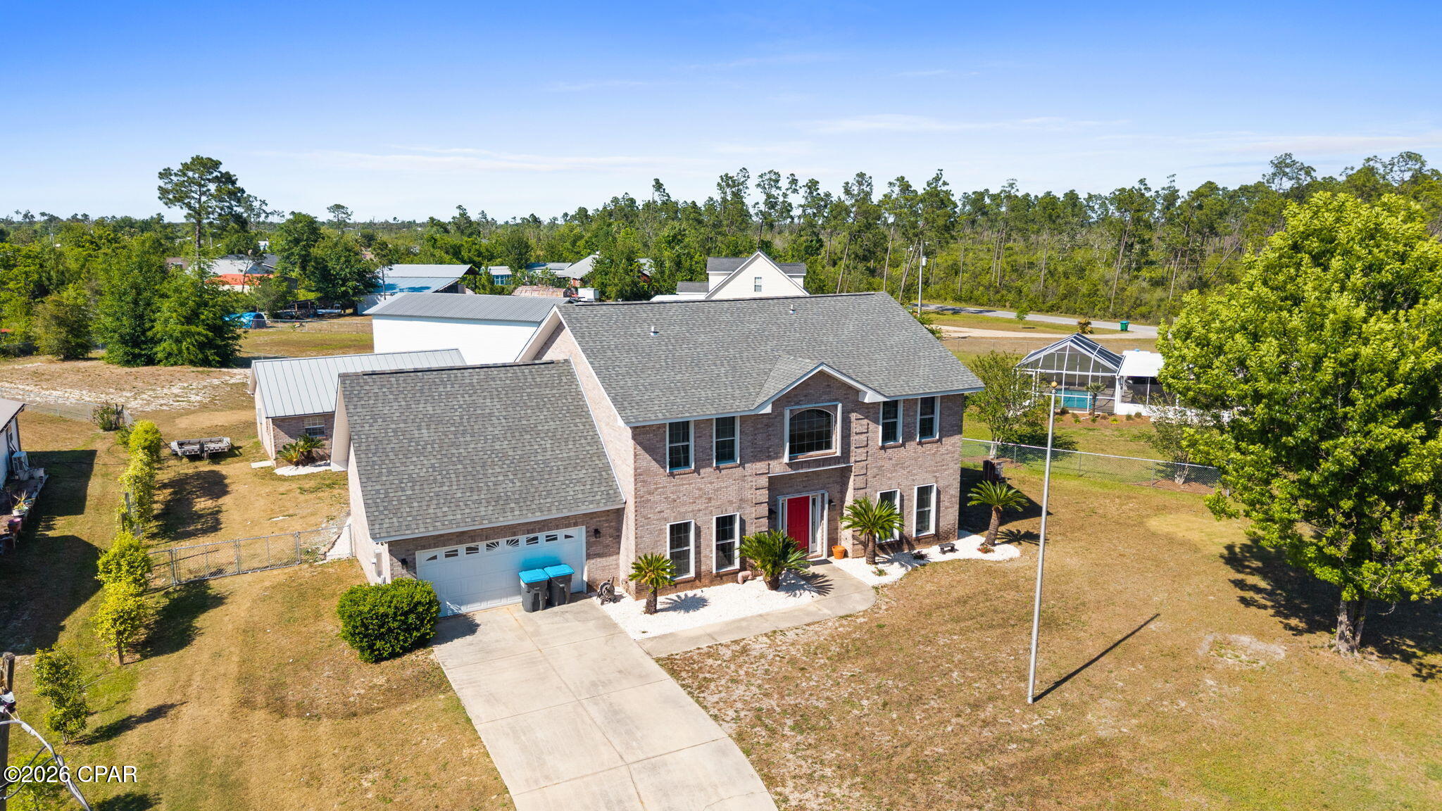 CURRENTLY UNDER CONTRACT, SELLER ACCEPTING BACKUP OFFERS 
This custom-built, all-brick two-story home offering over 2,800 square feet of living space, featuring 4 bedrooms, 3 bathrooms, and situated on more than three-quarters of an acre.

As you step inside, you're greeted by soaring 20-foot ceilings that create an impressive sense of space and natural light throughout the main living areas. The updated kitchen is designed for both style and function, featuring granite countertops, stainless steel appliances, and an open layout that flows seamlessly into the great room and breakfast nook, making it perfect for everyday living and entertaining.

The home also offers a separate living room with a cozy fireplace, providing a warm and inviting space to relax. The primary suite serves as a private retreat and includes a beautifully updated bathroom, while updated flooring throughout the home adds a modern touch.

Outside, the property continues to impress with a large shop with electricity and a detached garage, offering plenty of space for hobbies, storage, or a workshop.

With its spacious layout, quality construction, and expansive lot, this home offers the perfect combination of comfort, functionality, and room to grow.