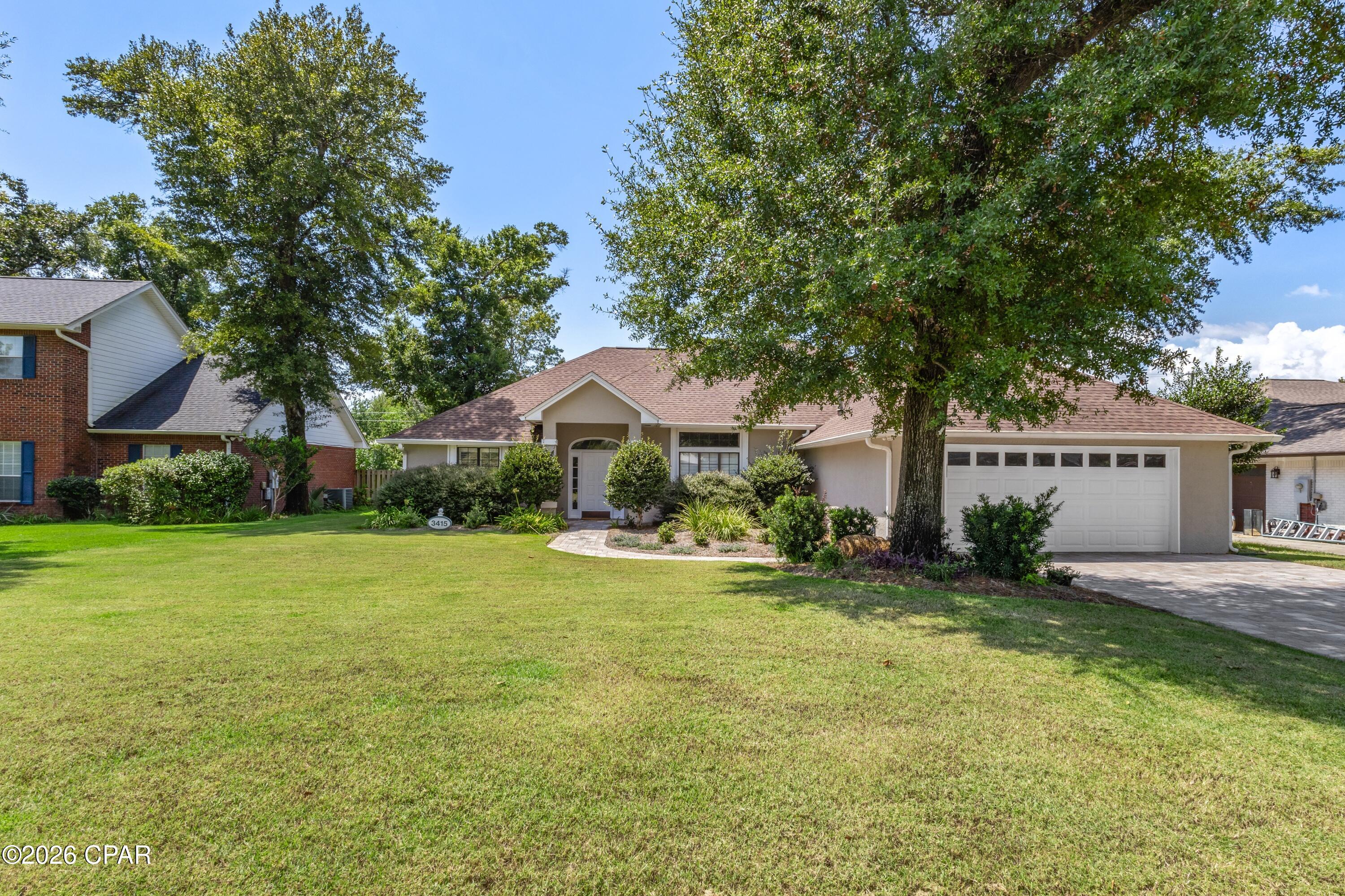 Enjoy quiet cul-de-sac living and the country club lifestyle in this move-in-ready 3-bedroom, 2-bathroom home in Lynn Haven's Panama Country Club neighborhood. Tucked away on a low-traffic road just off the main circle, this home offers privacy and a peaceful setting. Located just a block from the water, the community is perfect for golf cart rides and enjoying the coastal lifestyle. An optional country club membership offers access to the private 18-hole golf course, bayfront dining at the clubhouse, gym, dock, and pool.
Inside, the home features LVP flooring throughout, new countertops, updated light fixtures, fresh paint, and a generator. The spacious layout includes a large Great Room anchored by an electric fireplace, with sliding glass doors that open to the porch area, along with a formal dining room, custom kitchen, breakfast nook, Florida Room/Office, and oversized laundry room. The split-bedroom floor plan provides added privacy, with a spacious primary suite featuring a large dressing area, double vanity, and walk-in closet.
Step outside to enjoy the private backyard and open porch. 
All information is deemed reliable but should be verified by the buyer. Call today to schedule a private showing!