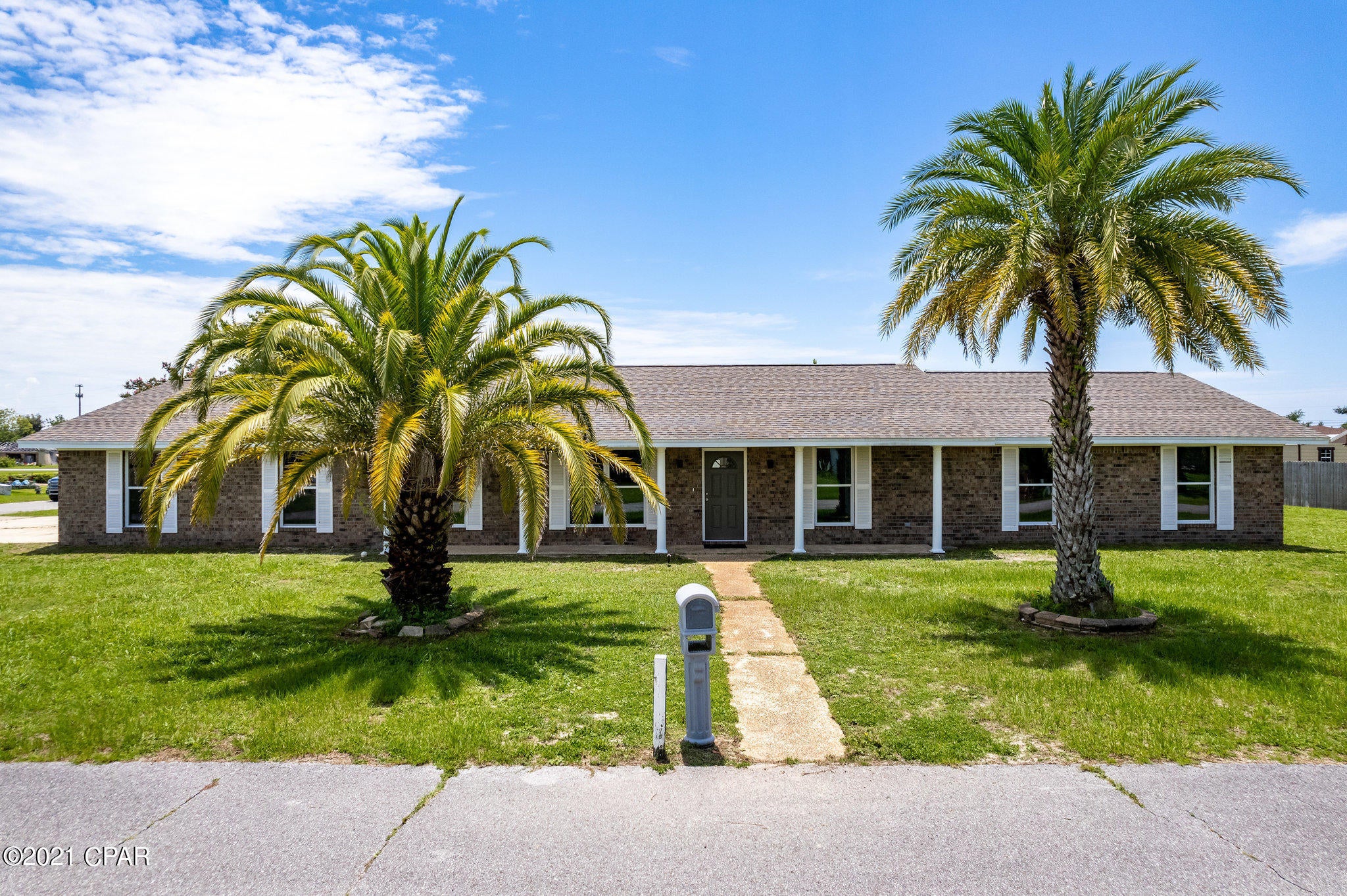 Amazingly 4 bed/2ba home on large corner lot close to Tyndall AFB. Huge Liv Rm big enough for any family gathering. Beautiful bright kitchen with new LG S.S. appliances, eating bar & is opened to the family room with its gorgeously tiled F/P. Large room off kitchen offers many possibilities. Inside laundry room w/ ample space for storage. The hall bath features dual vanities/sinks so there is no reason the kids can't be brushing their teeth together. The tiled tub/shower surround will impress. The M. bed features dual closets & a slider to the backyard. The M. bath has dual vanities & features the same amazing tile in the oversized shower & there is a dressing room off the bath (did someone say shoe shopping?) Oversized garage with room for workshop and the driveway has full RV hook up.