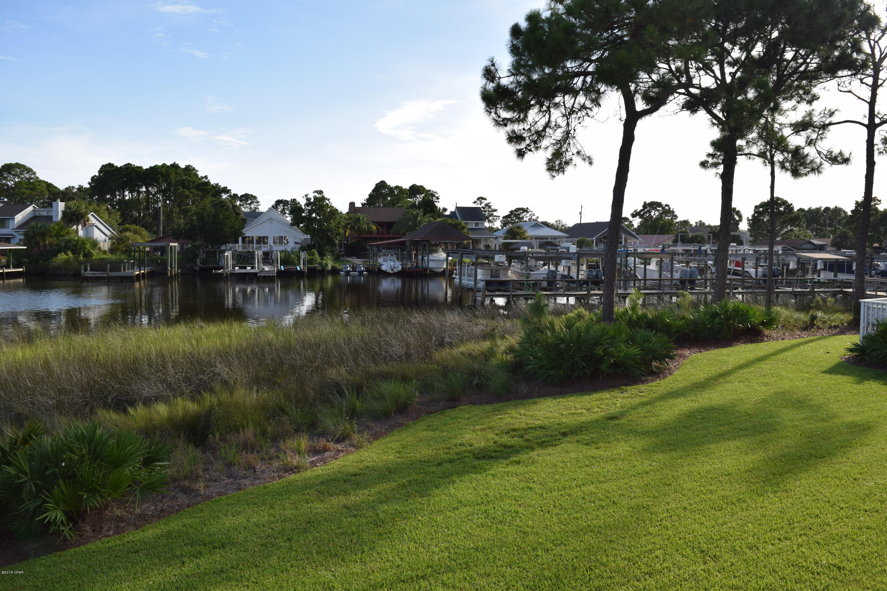 Great location, great view! Located in Panama City Beach  with beautiful views of the lagoon! This 2 bedroom, 2 bath condo in a small complex on N. Lagoon also has a community pool. Laminate floors in the main areas, carpet in the bedrooms, laundry closet, and a sun-room. The beach is just a few minutes away as are many good restaurants. This unit does not convey with a boat slip.