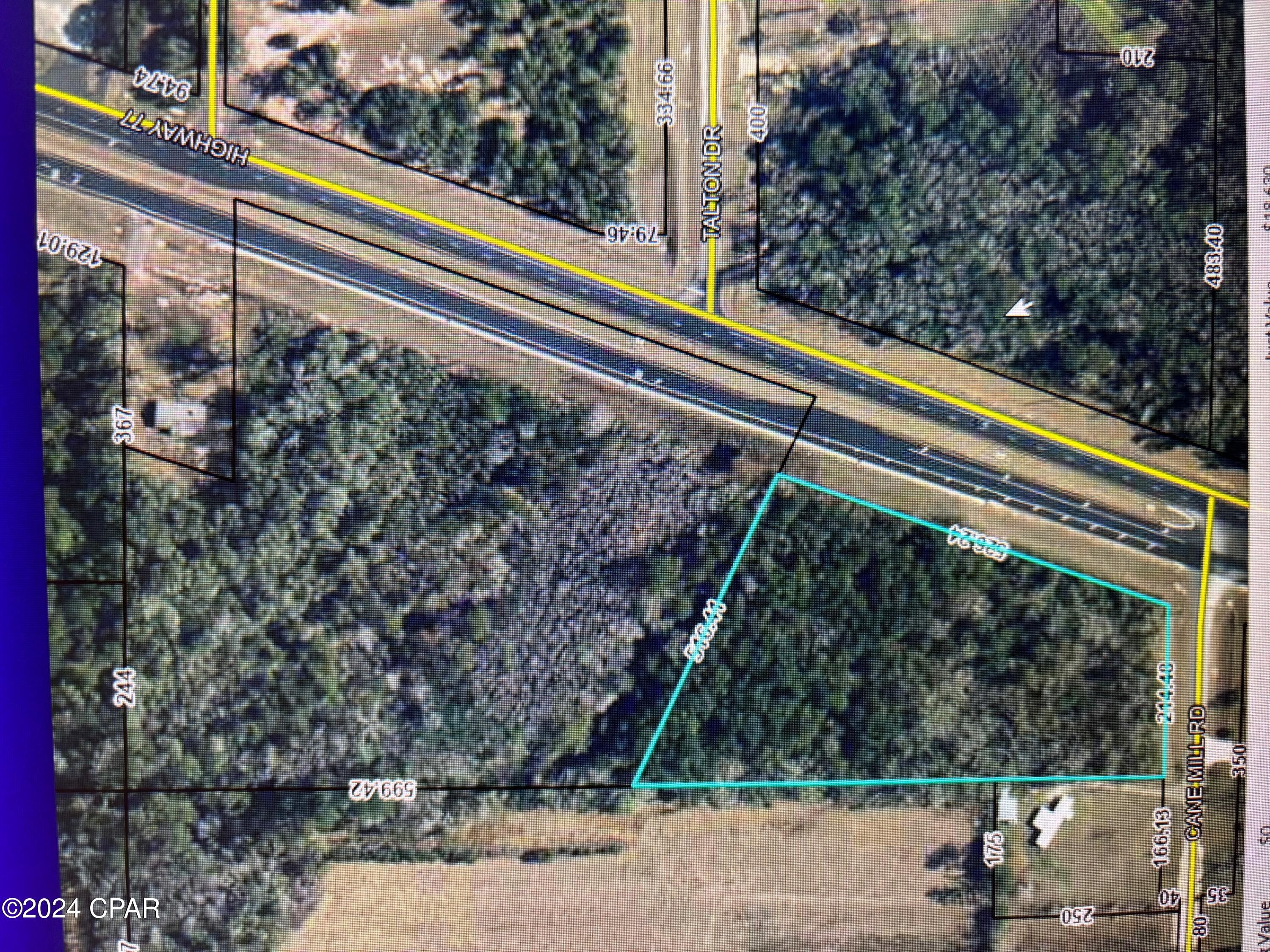Great location for home or business and plenty of room for both. This property has beautiful trees and lots of highway frontage on Highway 77.