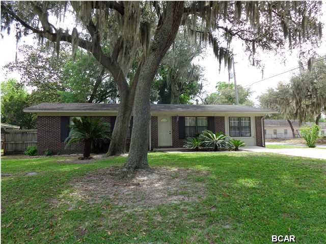 This charming Lynn Haven home is a must see! Pride of ownership is evident throughout the house. Completely updated with granite, flooring and crown molding, you will want this to be your new home as soon as you enter the cost environment this home offers. The kitchen features granite, a pantry and a work island for extra counter space. The home features two bedrooms and an office, along with two baths. On a corner lot, the property also has a detached garage and workshop. There is a sprinkler system to keep your lawn green and oak trees for shade whil you sit on your screened and tiled back porch. A new roof is being put on and will be completed no later than May 10. All measurements are approximate. Pleases verify if important.