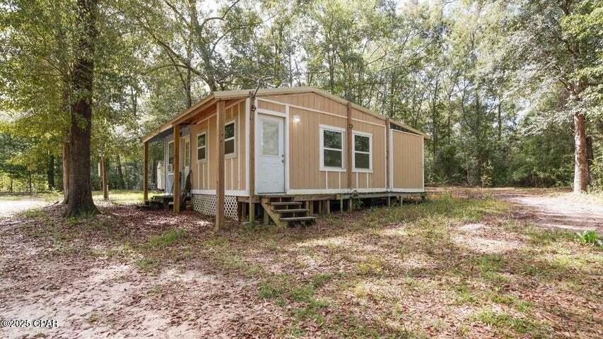 County Setting Close to the City. 2 acres of a nice wooded lot with a 1 bedroom 1 bath place on it. Look at the pictures there still needs work do to complete remodel. Most of the items needed are there. Has fenced area for Gardening. Nice lean to to keep your lawnmower. New fiberglass building does not convey. Want to be close to shopping and eateries but want the feel of country living this is the place for you...Call for showing appt. The cottage has a large almost finished great room area that measures 13x20 that has shiplap walls, a brand-new bathroom (still needs some fixtures) - that also has accommodations for a washer and dryer, and a nice sized bedroom - conversion of old bathroom has been started to be turned into a closet. Lots and lots of potential here! The property includes a small, fenced area for animals or for a garden. Property sold as is