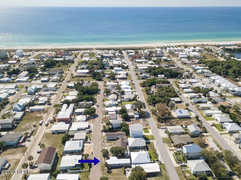 Fantastic location on the West End of PCB that is just a few short blocks to the sugar white sands of the World's Most Beautiful Beaches!! Walk to the very popular Carousel Market, Thomas Donuts, or the beach! Property includes a single wide mobile home and outbuilding that has been owner occupied and never rented although short term rentals are allowed in this area. Home has a new metal roof as well as screened in porch, 3/4 inch plywood subfloor, LVP flooring throughout, new hot water heater, reinforced hurricane straps and tiedowns, and more. Outbuilding has water and electricity and could be potentially converted to additional living space. On the beachside, Laguna Beach has new oceanfront sidewalks that provide walking access for miles overlooking dedicated beach land that can not be built on! For the price of a lot in this area, you can have a 50 X 65 lot WITH a home and move in today and plan your next move. Schedule your showing and build your dream home tomorrow or rent out the current home while you get your plans together!