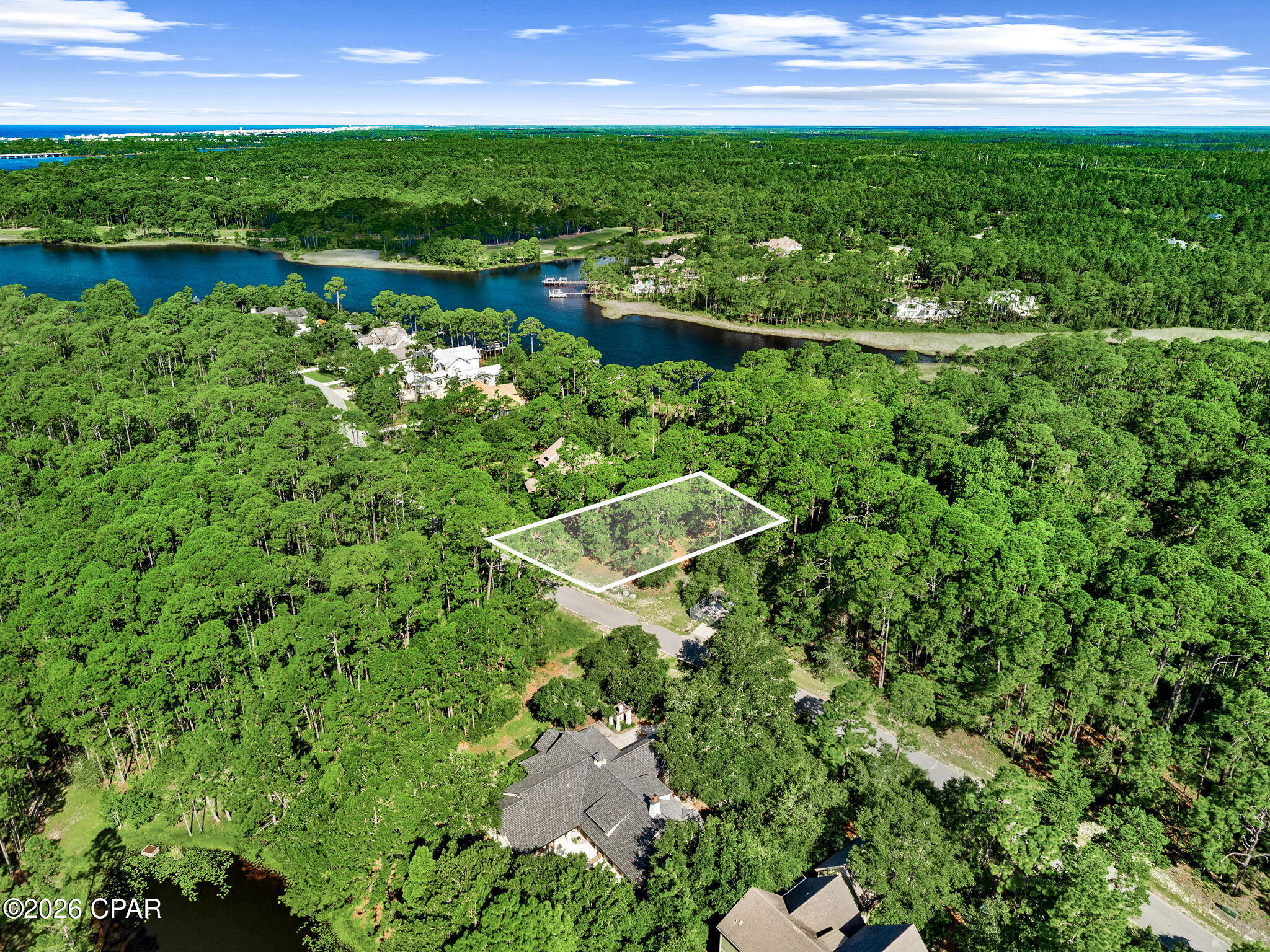 Build your dream home in the beautiful,  gated community of Wild Heron. Located at 22110 Marsh Rabbit Run, this spacious wooded homesite offers a peaceful setting surrounded by mature pines and the natural beauty that makes Wild Heron so special. With its generous size and established surroundings, the property provides an ideal canvas for a custom home designed to take advantage of the privacy and serene setting.

Wild Heron is nestled along the shores of Lake Powell, Florida's largest coastal dune lake, offering residents a unique combination of nature, recreation, and coastal living. Community amenities include a lakeside swimming pool, fitness center, community dock, scenic walking and biking trails, playground, and beautifully preserved natural areas throughout the neighborhood. Wild Heron is also home to the private Shark's Tooth Golf Club.

Enjoy the tranquility of a gated community while remaining just a short drive from the sugar-white beaches of the Gulf, Scenic Highway 30A, Pier Park, dining, shopping, and everything Panama City Beach has to offer. 22110 Marsh Rabbit Run is an exceptional opportunity to create a custom home in one of Northwest Florida's most distinctive communities.