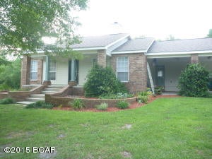 LITTLE PIECE OF PARADISE on this quiet 5 acre parcel complete with pond and lots of trees. Built in 2001, this home has lots to offer in design and livability. Cathedral ceiling in living room and kit makes it feel extra spacious. The fireplace is double sided adding ambiance to LR and DR! The kit has a large island that will become the center of activity in any gathering. The rooms are large and the MBR also has a cathedral ceiling and access to the covered back porch thru French doors. MBA has sep shower and dbl vanity. Large covered back porch is a great place to end the day, watching the kids play in the backyard! Open deck is great for grilling. Laundry room is huge and lots of storage. In the country, but close to shopping. age,room sizes, sq ft estimates. plz measure if concerned.