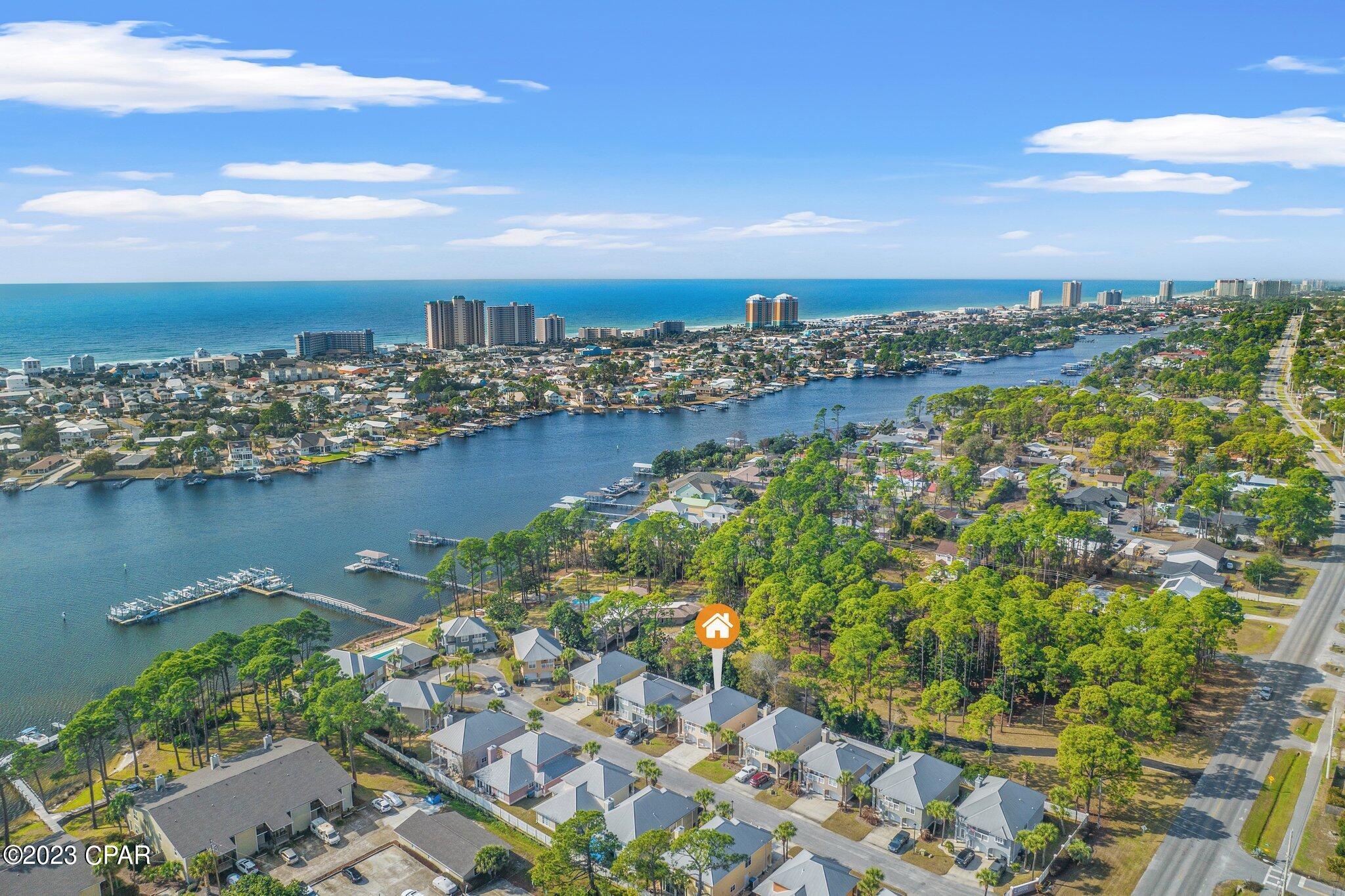 BOAT SLIP with each home in this gated, friendly neighborhood. This home also comes with a 10K pound lift to accommodate your boat for easy access to the lagoon and Gulf of Mexico! The kitchen is remodeled with beautiful hickory cabinets and gorgeous ''blue pearl'' granite.  There is a  finished bonus space large enough to be a 4th bedroom or a playroom.  This gated community has a community pool, pool house and dock. The home is vacant and move in ready. What the sellers loved most about this home was their water access, neighborhood gatherings, and their neighbors. The home has ample space with 3 bedrooms and 2 bathrooms.  The rear porch is closed in and now is a perfect little sunroom! Come see what Lagoon Estates and this home is all about.