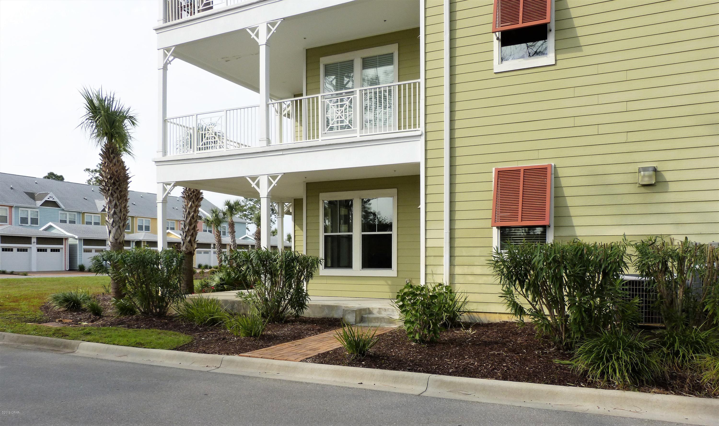 CURRENTLY UNDER CONTRACT, SELLER ACCEPTING BACKUP OFFERS. Enjoy condo living at its finest in this ground floor, corner unit, with wrap around patio, yard and palm trees and close to the garage entrance.  Gated community. The unit is move-in ready and features lots of added storage and shelving, updated ceiling fixtures, and an upgraded double shower. The spacious living/dining room has crown molding with bamboo flooring. The kitchen features granite countertops and stainless steel appliances. The grounds have sought after amenities including tropical landscaping, one acre lagoon style pool with fountains, splash pad and hot tub, garage parking, game room, fitness center and basketball court.   All measurements are approximate. Please verify if important.