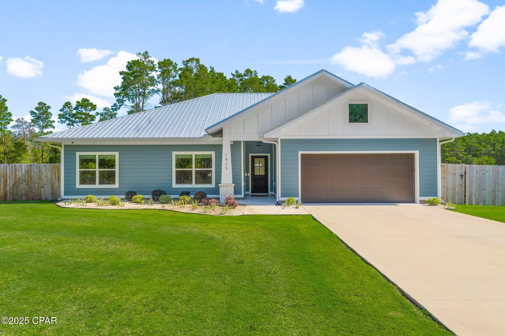 This fantastic home, originally built as the Scholarship Home and showcased in the 2023 Bay County Parade of Homes, offers exceptional quality, thoughtful upgrades, and the peace and quiet of life in the sought-after White Western area. Set on nearly an acre, this former model home is ideal for anyone looking to enjoy a bit more space, privacy, and a slower pace.

Living outside the city of Lynn Haven means fewer restrictions, no HOA fees, and the kind of tranquility you cannot find in more densely populated neighborhoods. The home is designed with efficiency and long-term savings in mind, featuring foam insulation throughout (even over the garage) along with a private well and septic system, eliminating monthly water and sewer bills. Homeowners insurance is currently under $200 per month with a quality State Farm policy, and the property is located in flood zone X, so flood insurance is not required.

Inside, you'll find soft-close cabinetry, a stunning leathered granite island paired beautifully with sleek quartz countertops throughout the kitchen, upgraded lighting, energy-efficient windows, and heated mirrors in the primary bath. The layout is functional and inviting, with quality finishes and modern comforts throughout.

Outside, the property has been thoughtfully enhanced with over $75,000 in improvements. There is a generator plug already in place, so you can easily hook up a generator if the power goes out. The sellers cleared trees, added a fenced area for pets, constructed a spacious 23 x 31.5 screened-in patio with a concrete floor for relaxing and enjoying nature, and built both an 18 x 30 workshop with gutters, as well as a 14-foot tall, 18 x 35 pole barn with 50-amp service plug for a boat or RV. The sprinkler system is tied to the well, keeping the lush Bermuda grass green without added utility costs.

This is a rare opportunity to own a well-appointed, energy-efficient home with acreage, freedom, and upgrades already in place. If you've been waiting for the perfect blend of space, comfort, and quiet country living, this is the one. Don't miss your chance to make it yours.