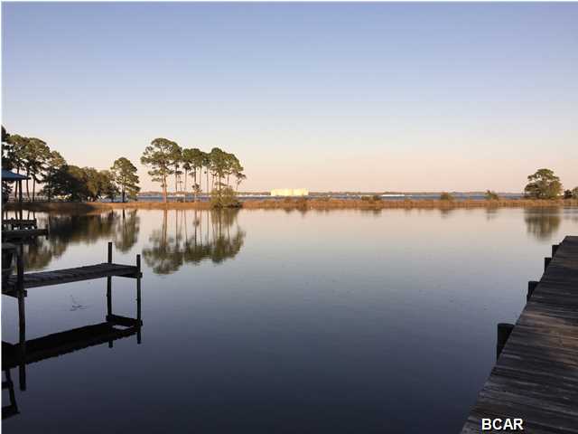 Build your dream home on this beautiful waterfront property with a stunning view of St. Andrews Bay. There is gulf access for a small boat of jet ski. This property is located in a quiet area of Panama City Beach near Waterhaven, The Preserve, Bay Point, Navy base, beaches and restaurants.