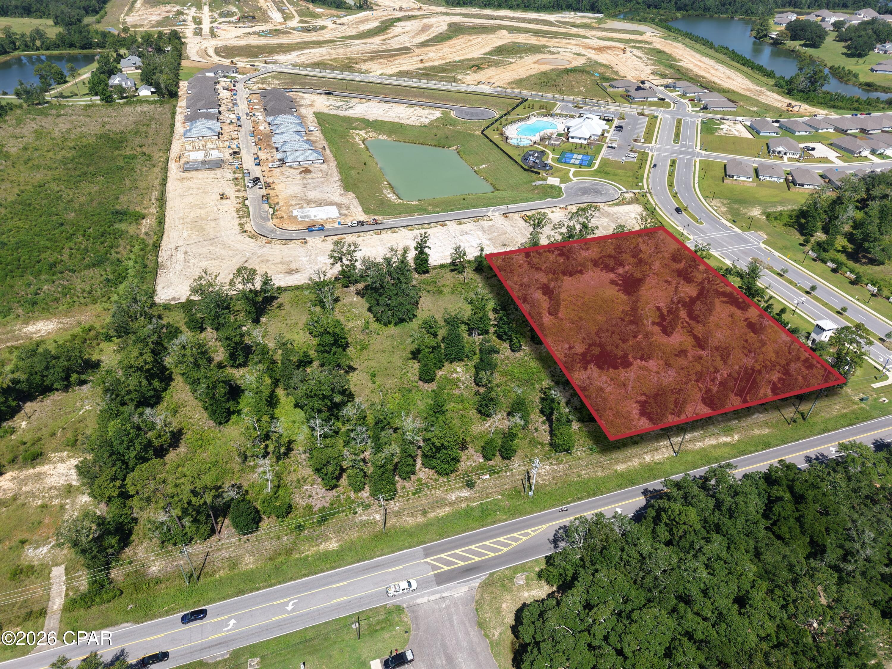 Situated in the rapidly expanding city of Pace, FL, this hard corner parcel is well-positioned to leverage its location along the primary commuter arterial of Woodbine Road and at the head of the +700-home Lakes of Woodbine subdivision. Measuring approximately 265'x315', zoned HCD and with all necessary utilities available to the site, the property is development-ready. As a part of the larger Pensacola MSA, the city of Pace has been a leading market for population growth and development. By extension, Santa Rosa County has seen tremendous growth in terms of new large employer growth, as well as being the primary destination for suburban residents working in the Pensacola market.

+/-2.2 Acres of Unimproved Commercial Land - development-ready greenfield site
Prime Hard Corner Location at Woodbine Road, the primary commuter arterial in Pace, FL
Fronting the Entrance to the 700+ Home Lakes of Woodbine Subdivision - built-in daily traffic and rooftops
Zoning: HCD (Highway Commercial District) - supports a wide range of commercial uses
All Utilities Available to Site 
Traffic Counts: +/-21,709 AADT on Woodbine Road
Excellent Visibility & Access with strong commuter exposure
Surrounded by Expanding Residential Communities and New Commercial Growth