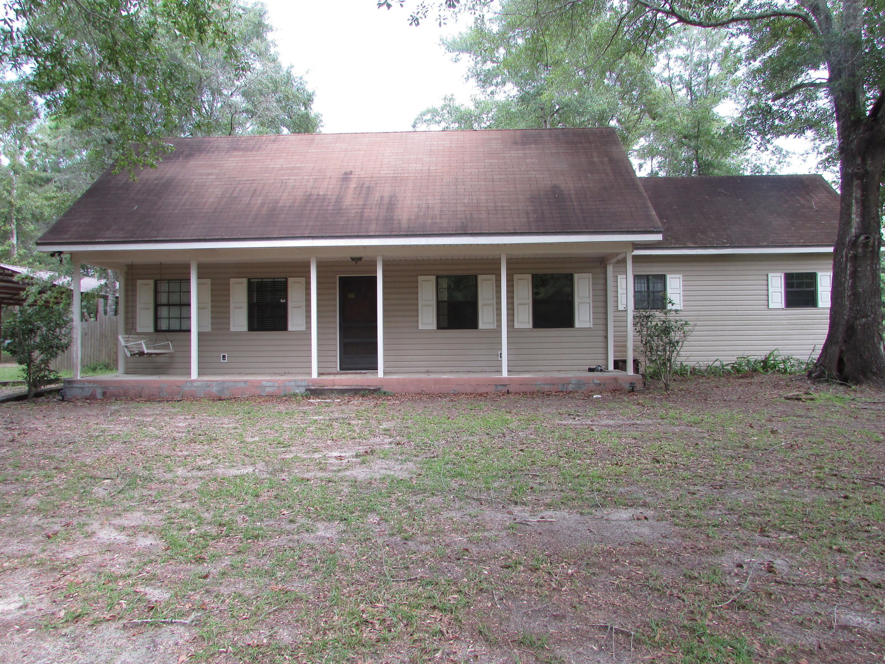 COUNTRY LIVING in CLARKSVILLE……. Large 4 Bedroom 2 Bath home with 1840 sq ft located in Clarksville just off Hwy 73. Close to Hwy 20. Relax on the front porch overlooking 2.65 acres! Vinyl siding home so little maintenance here!! Built in 1995.Two Pole Barns to cover your toys… Call today for more information!!!