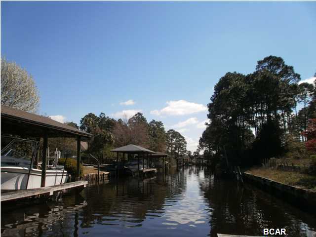 Waterfront building lot in established Northshore subdivision. Raised lot with fill, partially cleared,with 100 feet of canal waterfront. Canal leads directly into Upper Goose Bayou and North Bay and is deep enough to accommodate boats, kayaks and jet skis. Beachcomber Drive is a cul de sac street conveniently located to Lynn Haven's stores, parks, churches, and movie theaters, and just about 10-15 minutes to Panama City Beach.