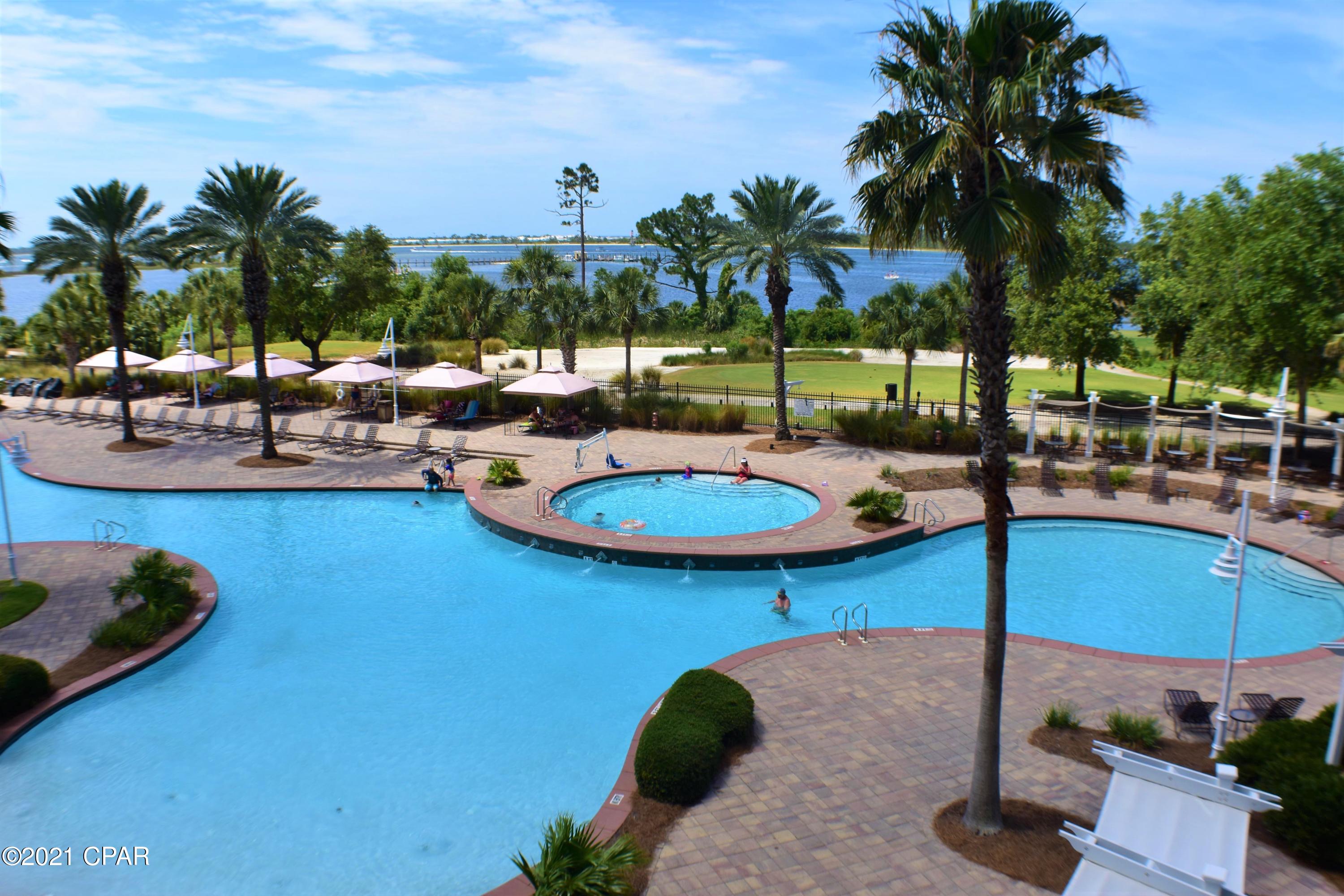 CURRENTLY UNDER CONTRACT, SELLER ACCEPTING BACKUP OFFERS. Absolutely gorgeous inside & out is the only way to describe this 1BR/1BA unit in Reflections at Bay Point!  Seller spared no expense in upgrades & design & you will fall in love with the million dollar view!  The unit boasts an open floor-plan with plank flooring, crown molding, granite countertops, rich cabinetry, large bath with dual access, double sink vanity, custom tiled walk-in shower, & the bedroom has a trey ceiling.  When you step out on to the balcony, you're greeted with a fantastic view of the freshly redone pool area, the golf course, & St. Andrews Bay!  Bay Point is a gated community with golf & tennis, 24 hour security, parks &  playgrounds, & the full service marina and  boat launch are currently being rebuilt.  All verified by Buyers if important.