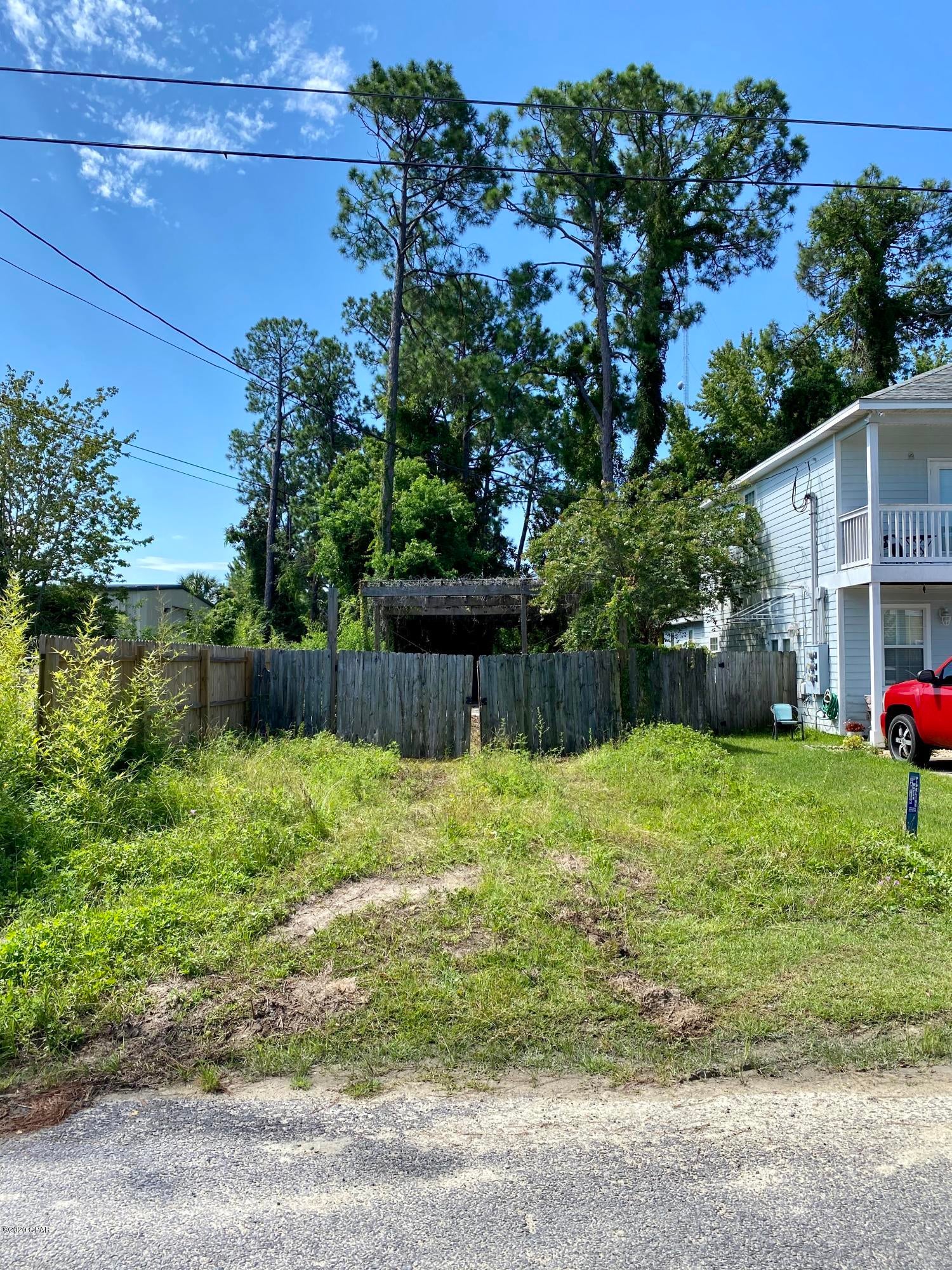 Zoned R3, this is a narrow lot that could be used for storage for a boat or RV. Property appraiser site shows a mobile home permit had been issued at one time. Currently has a large concrete pad and pergola overhang on the back portion of the property. Great lot for storage for a business or individual!