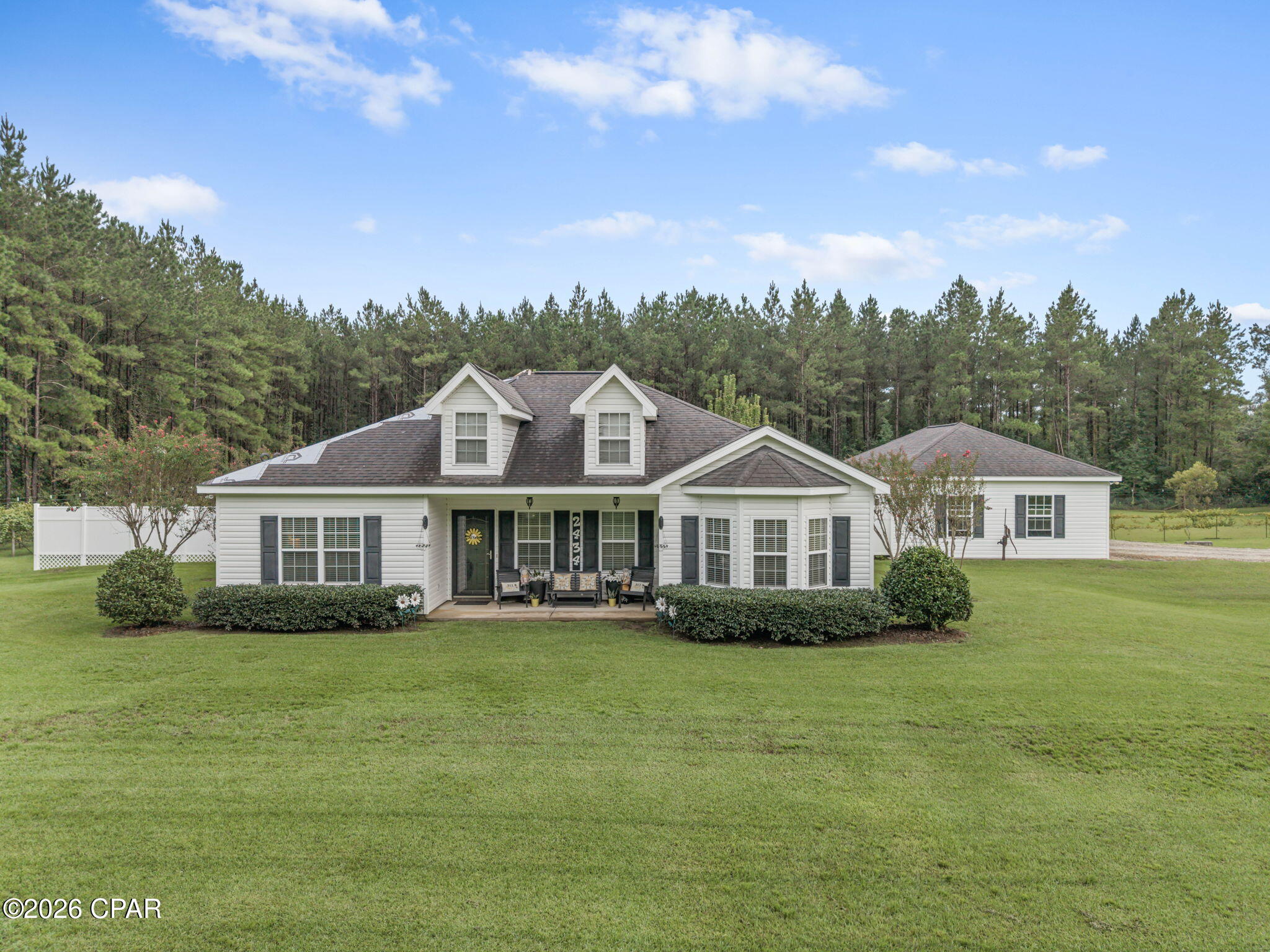 Discover this immaculately maintained 3-bedroom, 2-bath home with a 3-car garage, nestled on over 2 acres of pristine land surrounded by towering pines that create a peaceful and private country retreat. Built in 2008, this property has been cared for with exceptional pride and offers a wonderful blend of comfort, craftsmanship, and natural beauty--all while providing easy access to Marianna, I-10, and within approximately an hour of Panama City Beach and the World's Most Beautiful Beaches.
Inside, you'll find 9-foot ceilings, custom crown molding, and detailed millwork around the doors and windows. The spacious eat-in kitchen features solid wood cabinetry and granite countertops, while the split-bedroom floor plan offers privacy and well-organized storage throughout. Tile and carpet flooring add comfort and functionality, and the generous primary suite includes a sitting area, garden tub, separate shower stall. All bedrooms are comfortably sized to accommodate an established or growing family. The impressive 24' x 37' three-car garage provides abundant space for vehicles, hobbies, equipment, and storage.
Relax on the screened porch while watching the kids play in the backyard, or enjoy a refreshing dip in the above-ground pool during warm Florida summers. The outdoor kitchen area is perfect for entertaining guests or enjoying family evenings under the stars, especially as the cooler fall months arrive.
Outside, this property truly shines. Enjoy a meticulously maintained lawn, a muscadine and Carlos grape vineyard, a blueberry orchard, and an incredible variety of fruit trees, including pecan, pear, apple, plum, peach, kumquat, lemon, and fig. Beautiful herb and flower gardens are thoughtfully placed throughout the grounds, and a charming farmhouse-style chicken coop allows you to enjoy fresh eggs right at home. The backyard is secured with a 6.5-foot welded-wire fence to help keep wildlife out.
This is a special opportunity to enjoy the best of both worlds--a peaceful country setting with room to garden, grow, entertain, and enjoy the outdoors, while still being conveniently located near Marianna, I-10, and the beautiful Gulf Coast beaches of Panama City Beach.