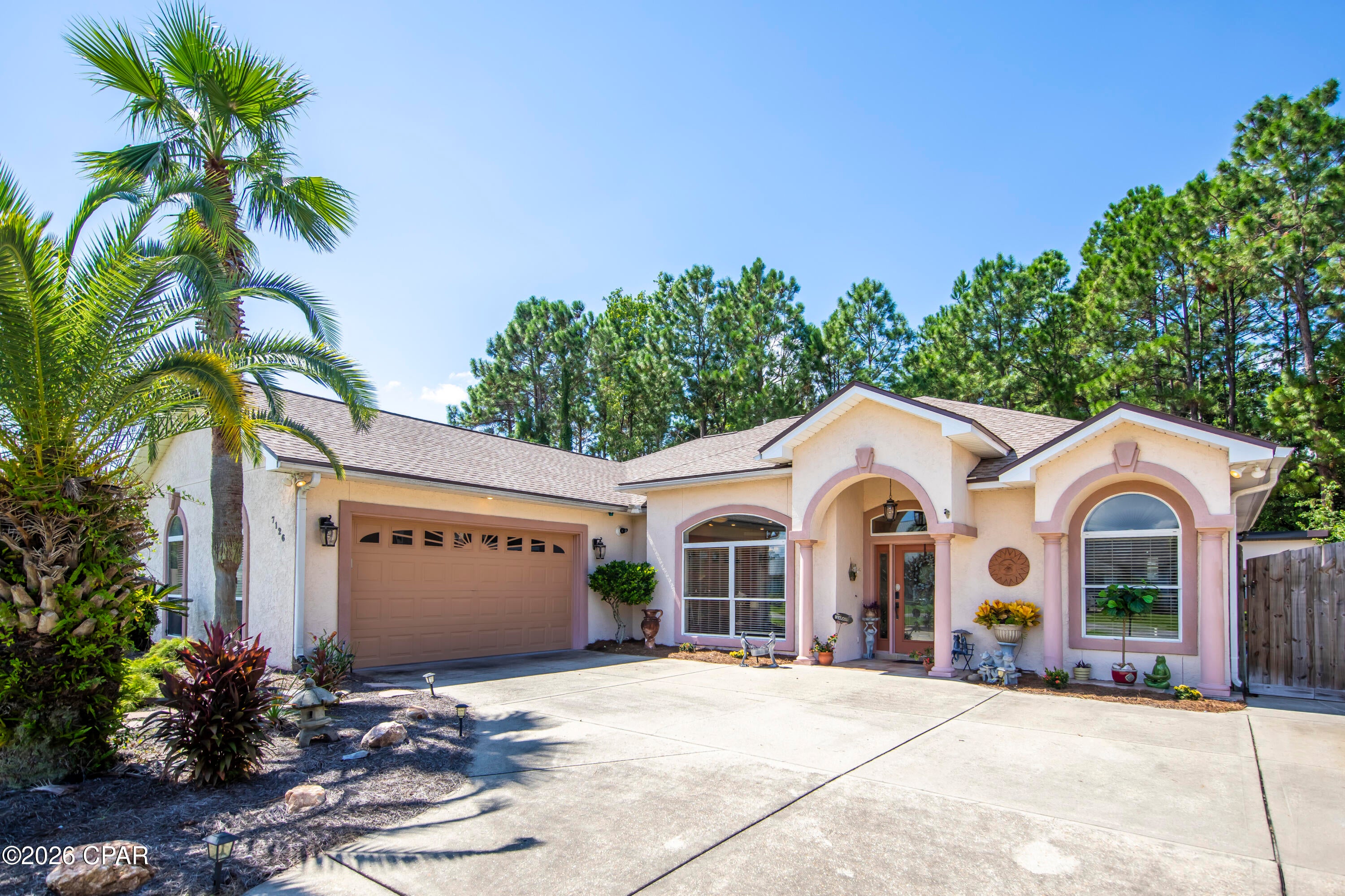 Beautiful custom home on the East End of Panama City Beach This 3-bedroom 2 bath home is loaded with upgrades! Granite Countertops, spacious Kitchen with island bar, custom built cabinets and gourmet gas cooktop. This home has a nice flow with a double-sided fireplace; surround sound built in speakers. corner unit tv and double trey ceilings with a light feature that can change mood and colors The Primary bedroom has a walk-in closet a custom soaking tub and a separate walk-in shower spacious spa like atmosphere. This home has a private enclosed 10,000-gallon saltwater pool. The outdoor living space has an outdoor kitchen with a gas fireplace and a beautiful waterfall and plenty of room for company. behind the pool enclosure is a handy workshop and plenty of storage. This home has a tank less water heater, a 2-car garage a whole house backup generator a boat pad to the side of the house. This home is located close to the bay and Panama City Beach has plenty of public access.