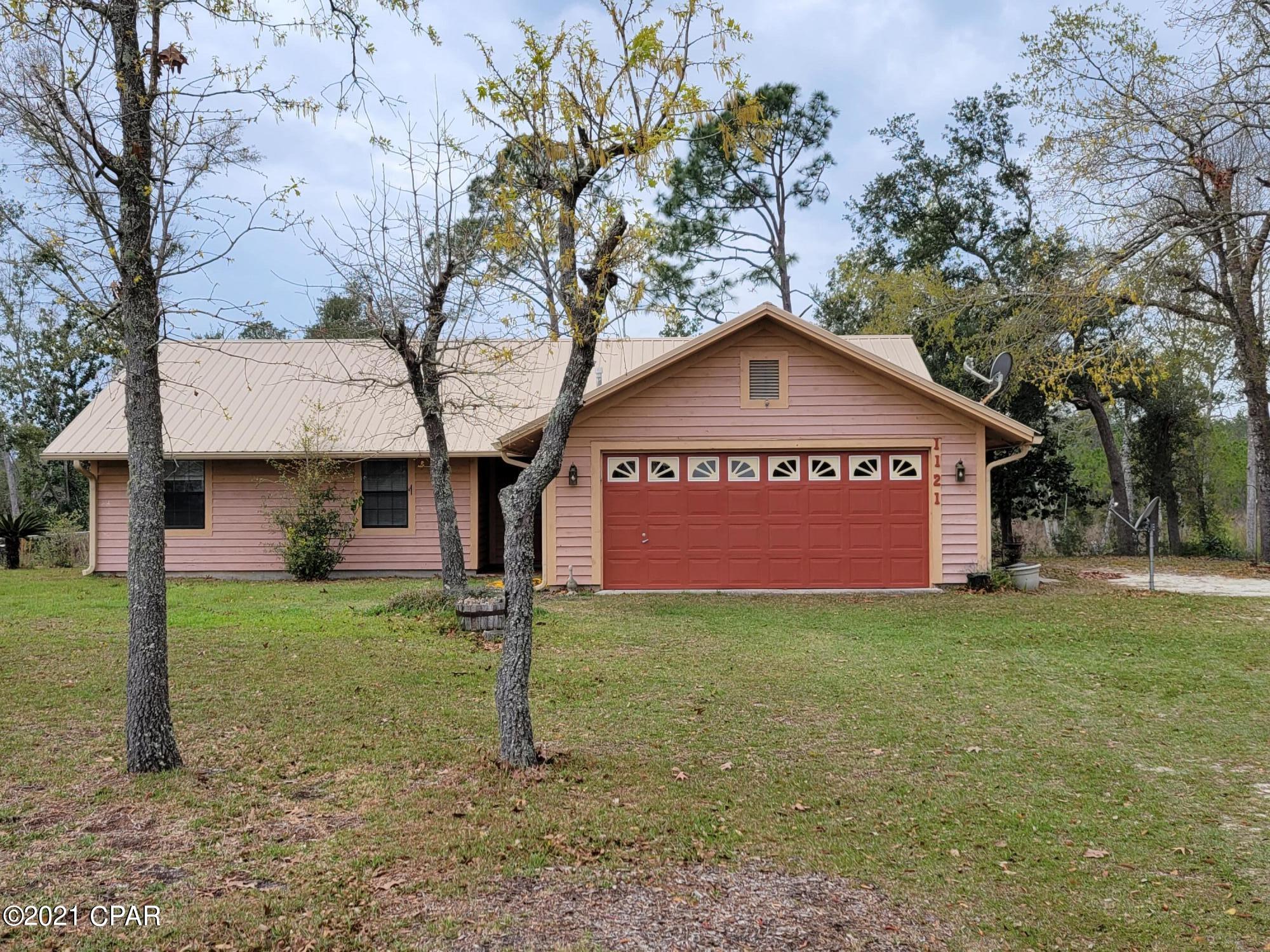Currently the property is under contract, accepting back up offers.  Custom Home which is well built with enough room for preferred privacy. Just over a 1 acre lot. The owner had this home built as he oversaw every nail or screw. The home has a great family feel with a spacious modern kitchen with all newer Stainless appliances.  Spacious dining and living room areas. Check out the true antique fully restored mantle and beautiful Fireplace in the living room. Relax in the large enclosed porch overlooking all the conservation area. The home has 3 bedrooms with master bedroom having it's full private bathroom. The 2 remaining decent size bedrooms share the additional bathroom.  The home has a 2 car attached garage, along with a totally separate enclosed shop for any and all projects.