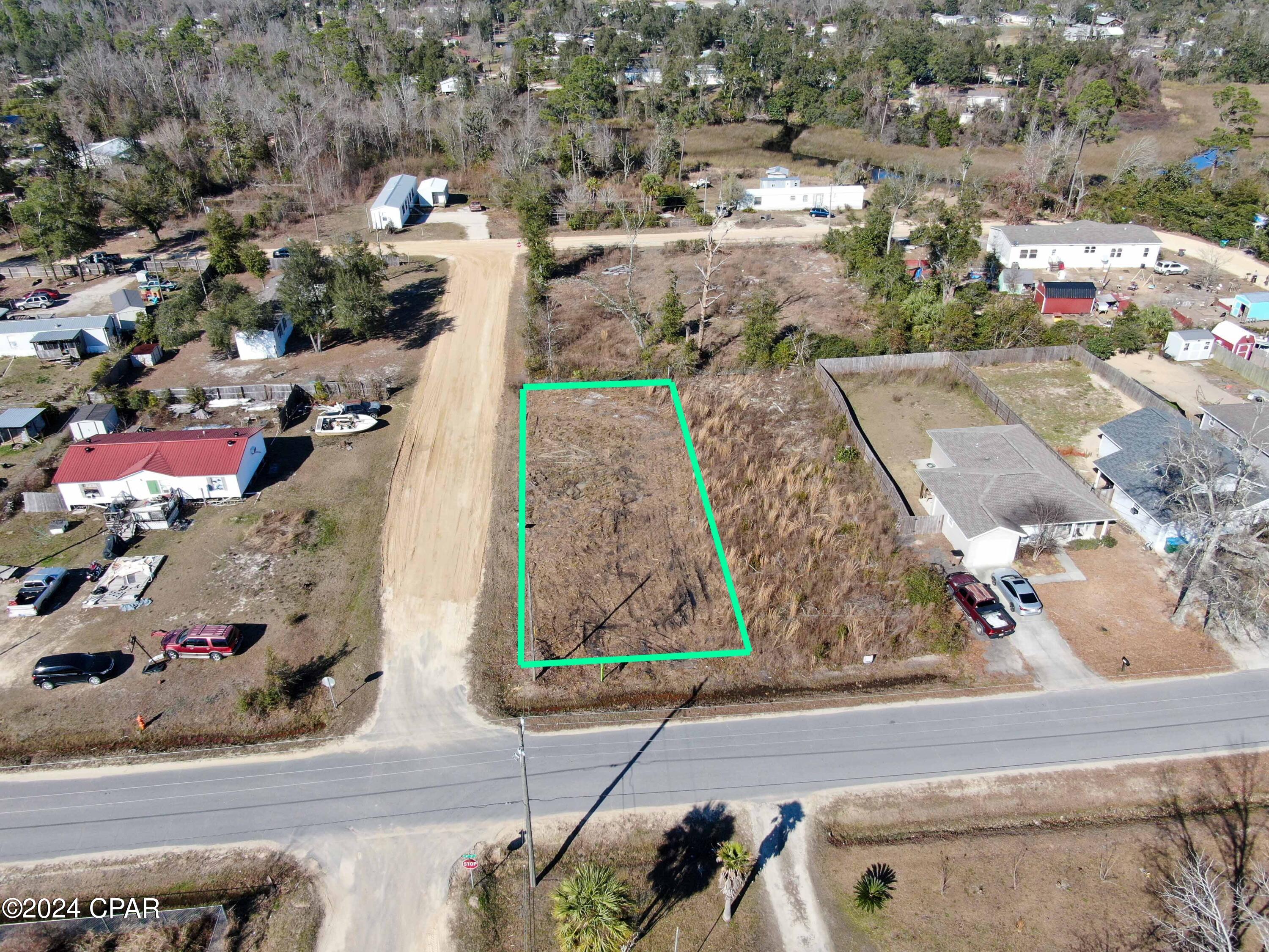 Vacant corner lot in the Southport Community ready for your dream home with NO HOA! Lot is cleared, level, high and dry. Current zoning is R-2. Mobile homes, and single family residential permitted.