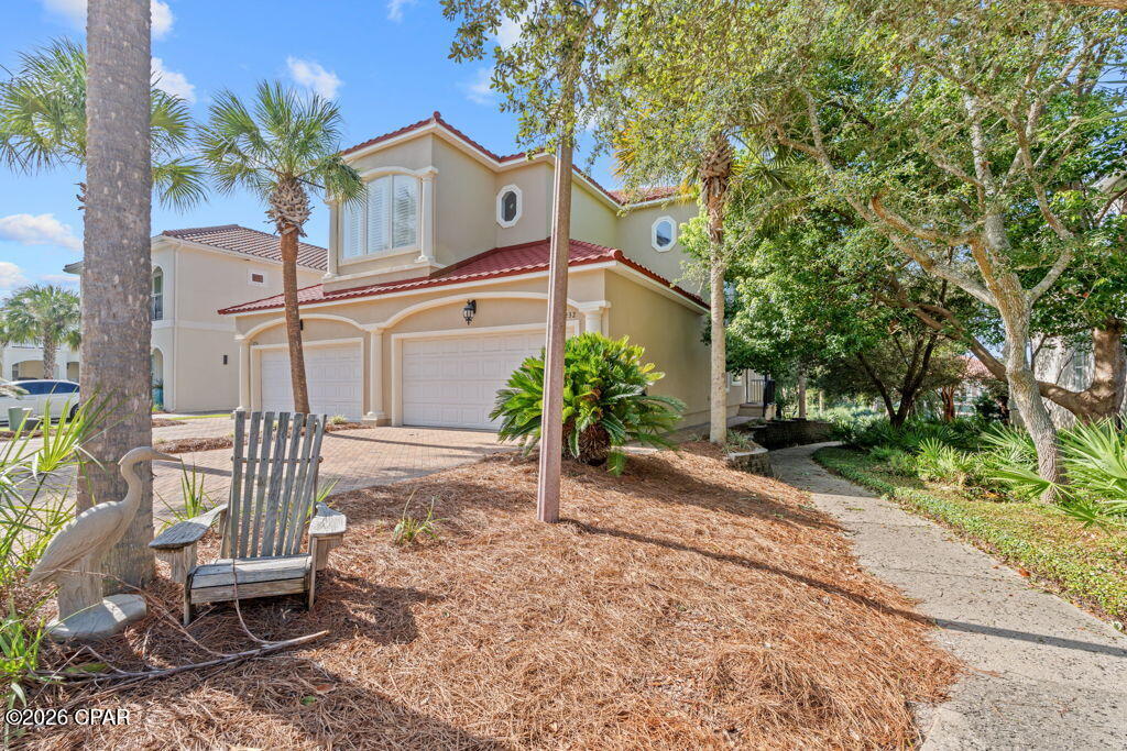 Discover the perfect blend of coastal living and resort-style amenities in this beautifully maintained 2-bedroom, 2-bath first-floor townhome located in the highly sought-after gated community of La Valencia Resort in Panama City Beach. Offering the convenience of a spacious two-car attached garage, this home features an inviting open floor plan and a screened-in back porch--the perfect place to enjoy your morning coffee or unwind after a day at the beach. Recent exterior updates, including a brand-new roof and fresh exterior paint, provide peace of mind and enhance the home's curb appeal. La Valencia Resort offers an exceptional lifestyle with private beach access, a Gulf-front pool, tennis courts, and a separate owners only pool with a beautiful clubhouse, all just minutes from the shopping, dining, and entertainment of Panama City Beach. Whether you're looking for a full-time residence, vacation getaway, or investment opportunity, this move-in-ready townhome is a rare find in one of the area's most desirable communities.  Sale includes a completely reconditioned Golf cart.