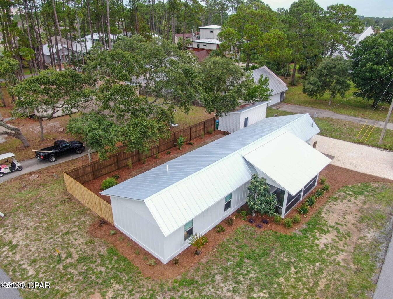 LIVE THE BEACH LIFE IN INLET BEACH HEIGHTS -- JUST 3 BLOCKS FROM THE BEACH!

-Unfurnished-

Welcome to one of the best locations in Panama City Beach! This beautifully renovated ranch-style cottage in Inlet Beach Heights puts you just 0.3 miles from Beach Access #95, giving you the freedom to enjoy the beach whenever you want. Located on the peaceful west end of PCB, you're also only minutes from the restaurants, shopping, and coastal charm of Inlet Beach, Rosemary Beach, and 30A.
From the moment you pull up, the home's corner-lot setting, fresh landscaping, and wraparound wood decking give it an inviting coastal feel. Inside, you'll find a bright and comfortable living space filled with natural light and thoughtfully updated finishes throughout.
The heart of the home is the beautifully renovated kitchen, featuring crisp white shaker cabinets, quartz countertops, stainless steel appliances, subway tile, custom floating shelves, and stylish pendant and recessed lighting. The open living areas are complemented by waterproof LVP flooring, updated bathrooms, fresh paint, modern fixtures, and gorgeous whitewashed pine ceilings that give the home a relaxed coastal character.
One of the home's standout features is the 200-square-foot screened porch, creating the perfect place to enjoy your morning coffee, unwind after a day at the beach, or gather with friends and family. French doors open to the private backyard and deck, where you can fire up the grill and enjoy the beautiful Florida evenings. There's even a hot-and-cold outdoor shower, making beach days that much easier.
The primary bedroom offers an added level of flexibility with its own exterior entrance and private rear sitting deck, creating a secluded retreat within the home. The property also provides ample parking, a detached workshop with electricity, plenty of storage, and convenient electronic locks with remote access.
Major updates throughout the home provide peace of mind while maintaining its charming beach-cottage personality, including a newer metal roof, updated siding and windows, newer water heater, updated HVAC, modern flooring, and hurricane-resistant protection for the home's doors and windows.
And the location is tough to beat. Lake Powell Beach Park and the boat ramp are less than a mile away, while grocery stores, restaurants, shopping, and everything the beaches along 30A have to offer are all within easy reach.
If you've been looking for a comfortable, beautifully updated home where you can truly embrace the Florida beach lifestyle, this is the one. Walk to the beach, relax on the screened porch, enjoy the private backyard, and make the most of everything Panama City Beach and 30A have to offer--all from your own coastal retreat.