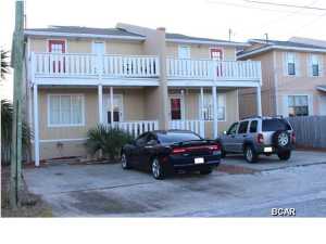 Walk to the Beach! Two story town home duplex with partial views to the Gulf of Mexico. Each side has 3 bedrooms and 2 baths. Keep as investment property or live in one side and lease the other. Other property features include a covered rear porch, storage room and privacy fenced yard. This property is priced to sell! No association fees!!!New Roof! New AC Units! New Appliances!