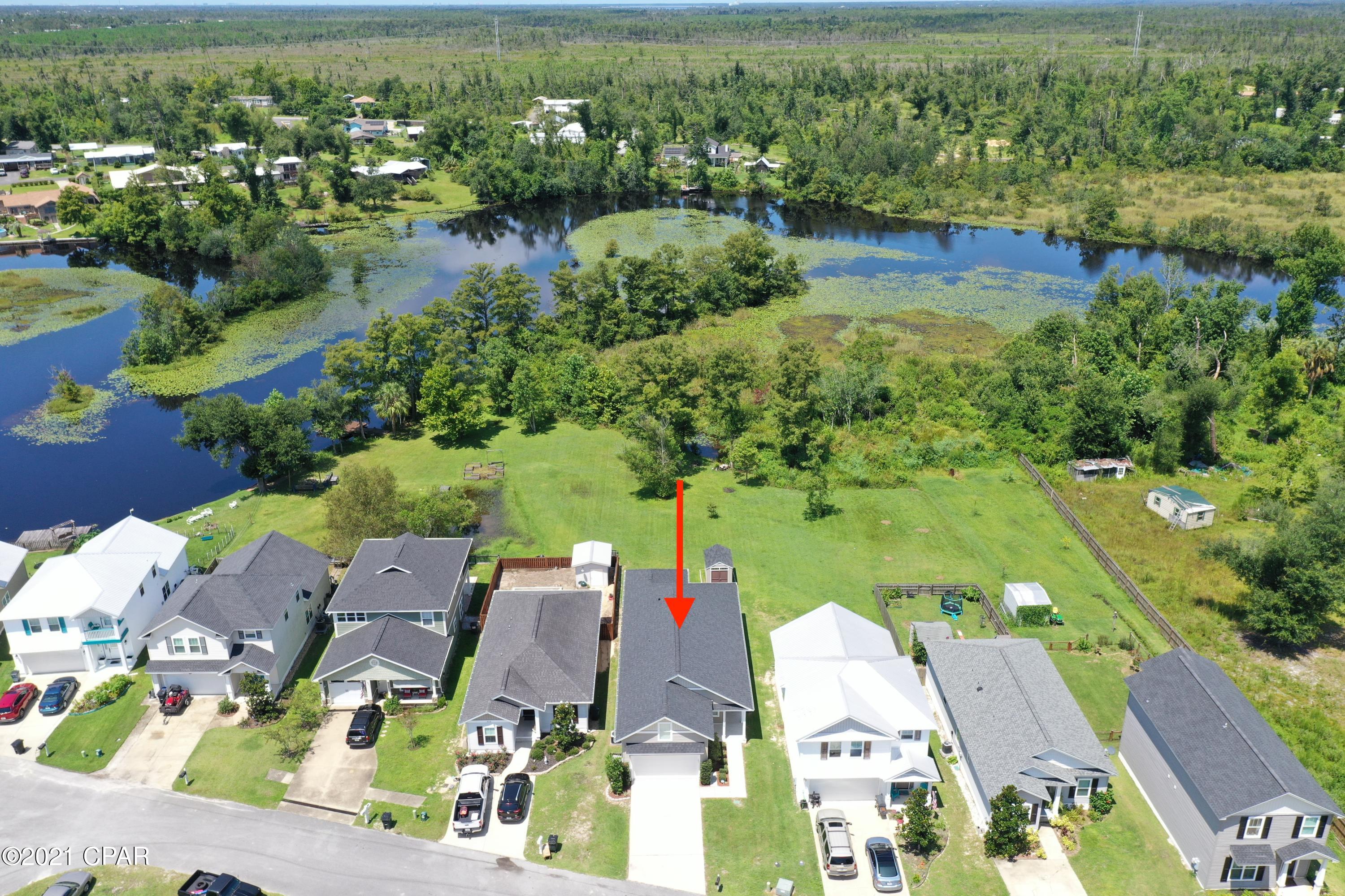 *CURRENTLY UNDER CONTRACT - ACCEPTING BACK UP OFFERS* Beautiful waterfront home just north of Panama City and in immaculate move-in ready condition with many upgrades! Deep 250' waterfront lot with kayak/paddle board access to enjoy serene views of the Lilly pads floating on the winding water leading to Deer Point Lake. Spacious master w/private entrance to the back deck, gorgeous double vanities, garden tub, separate shower and oversized closet. Large bonus 4th bedroom upstairs with it's own AC zone. Open floor plan with dining and three bedrooms on the first floor and a great kitchen island for entertaining. Garage has plenty of storage for your water toys plus a shed in the back. Close to Deer Point dam, and boat ramp. A short drive to Tyndall AFB & the World's Most Beautiful Beaches.