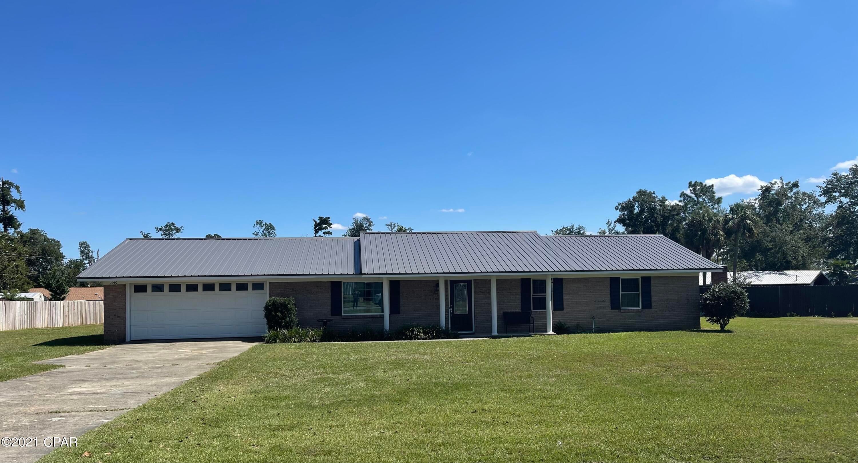 Home with 3 bedrooms, 2 baths in quite Wildwood Estate. Home features built in shelves with Decorative fireplace in large living area. Tiled flooring through the house. Crown molding. Newly painted cabinets in the kitchen and breakfast bar. The lot is approximately a half acre. French doors open onto back patio. New metal roof installed in 2019.